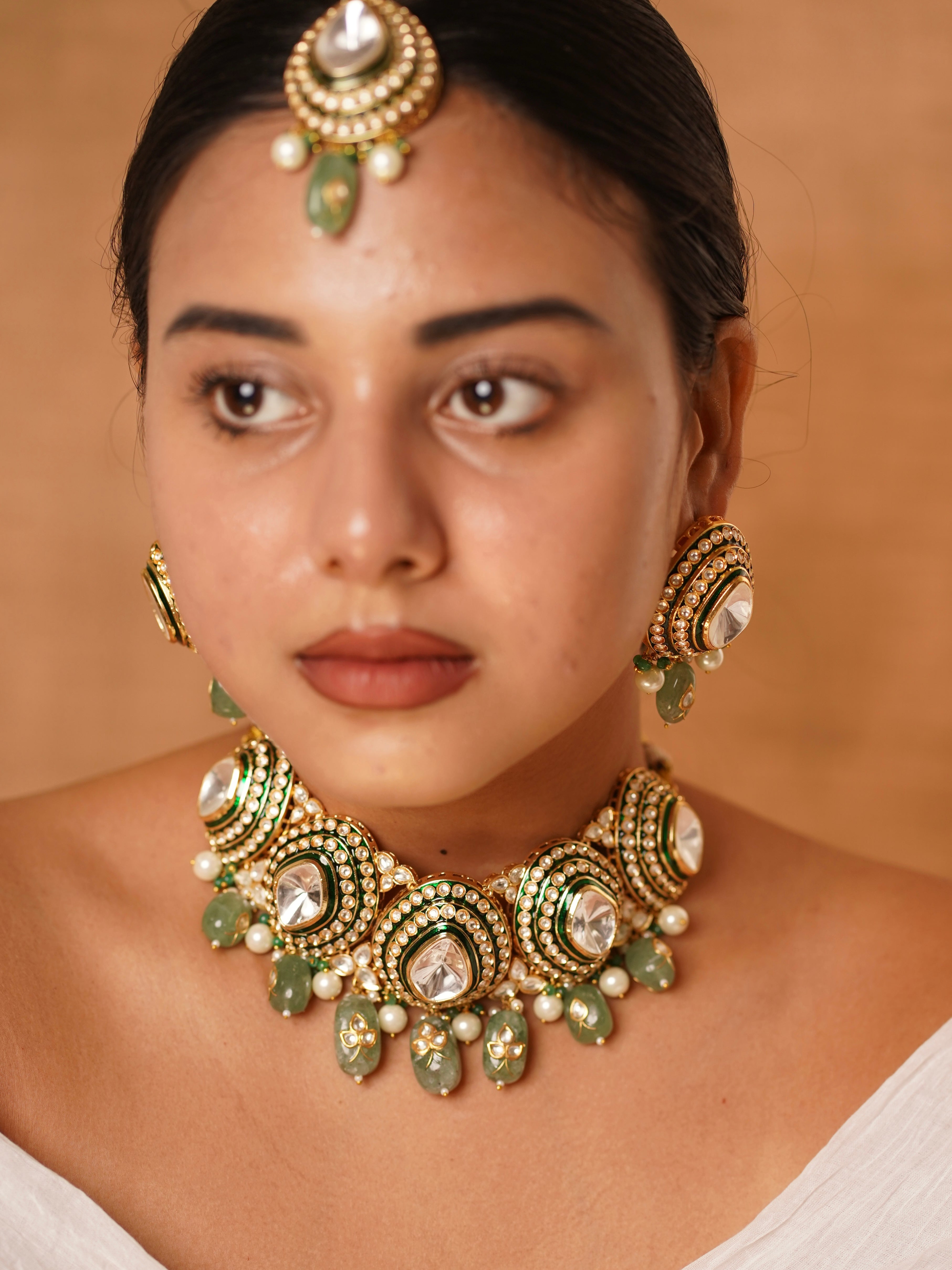 Side view of Aarohi choker necklace showing polki stones and matching statement earrings