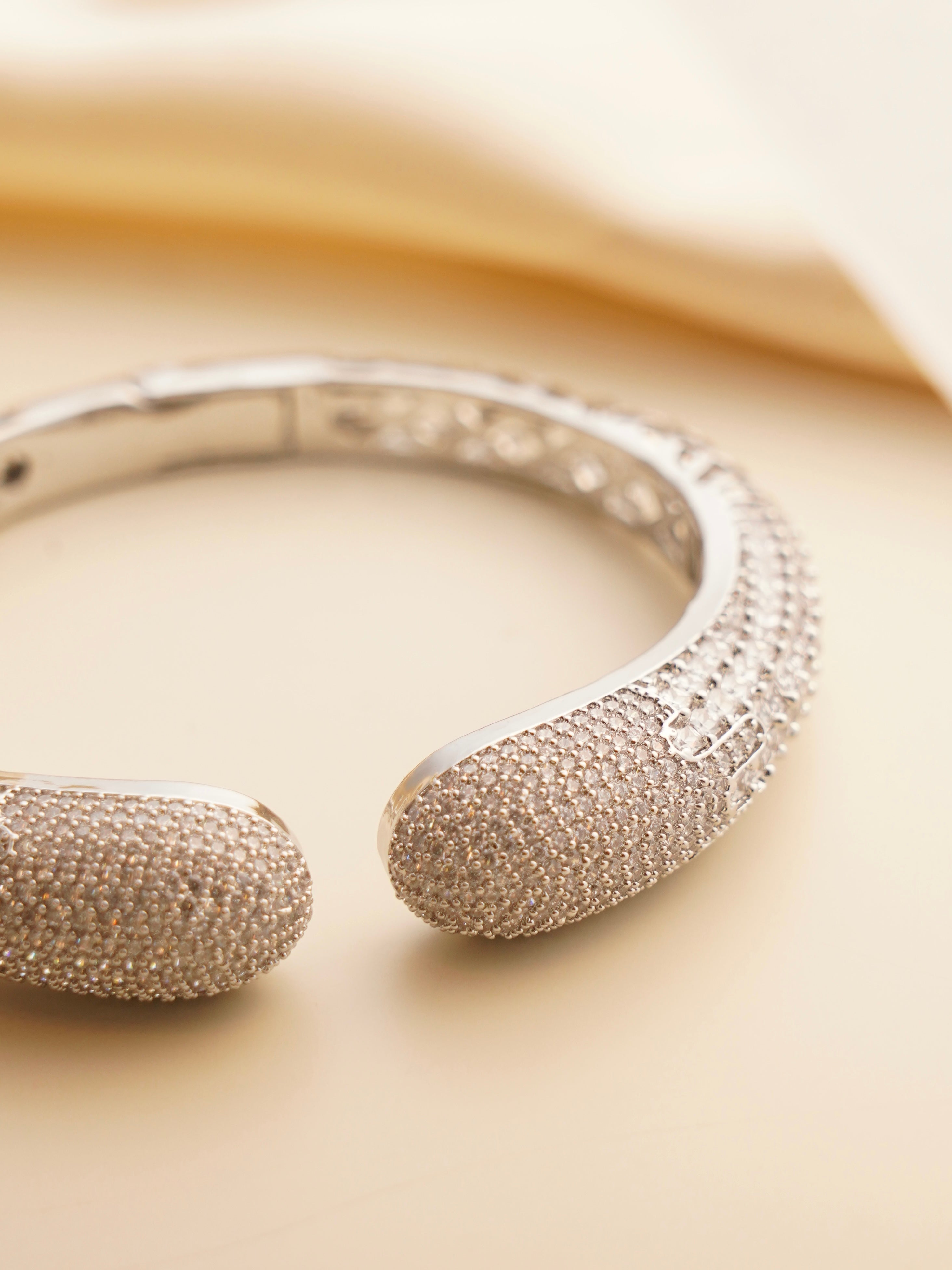 Side profile of sleek openable bracelet with sparkling zircon arrangement