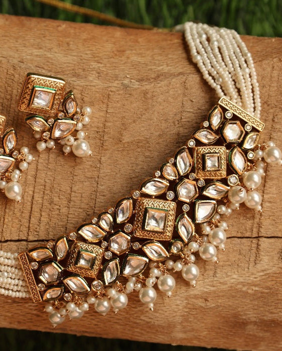 Elegant pearl choker necklace set with layered strands and silver-toned accents