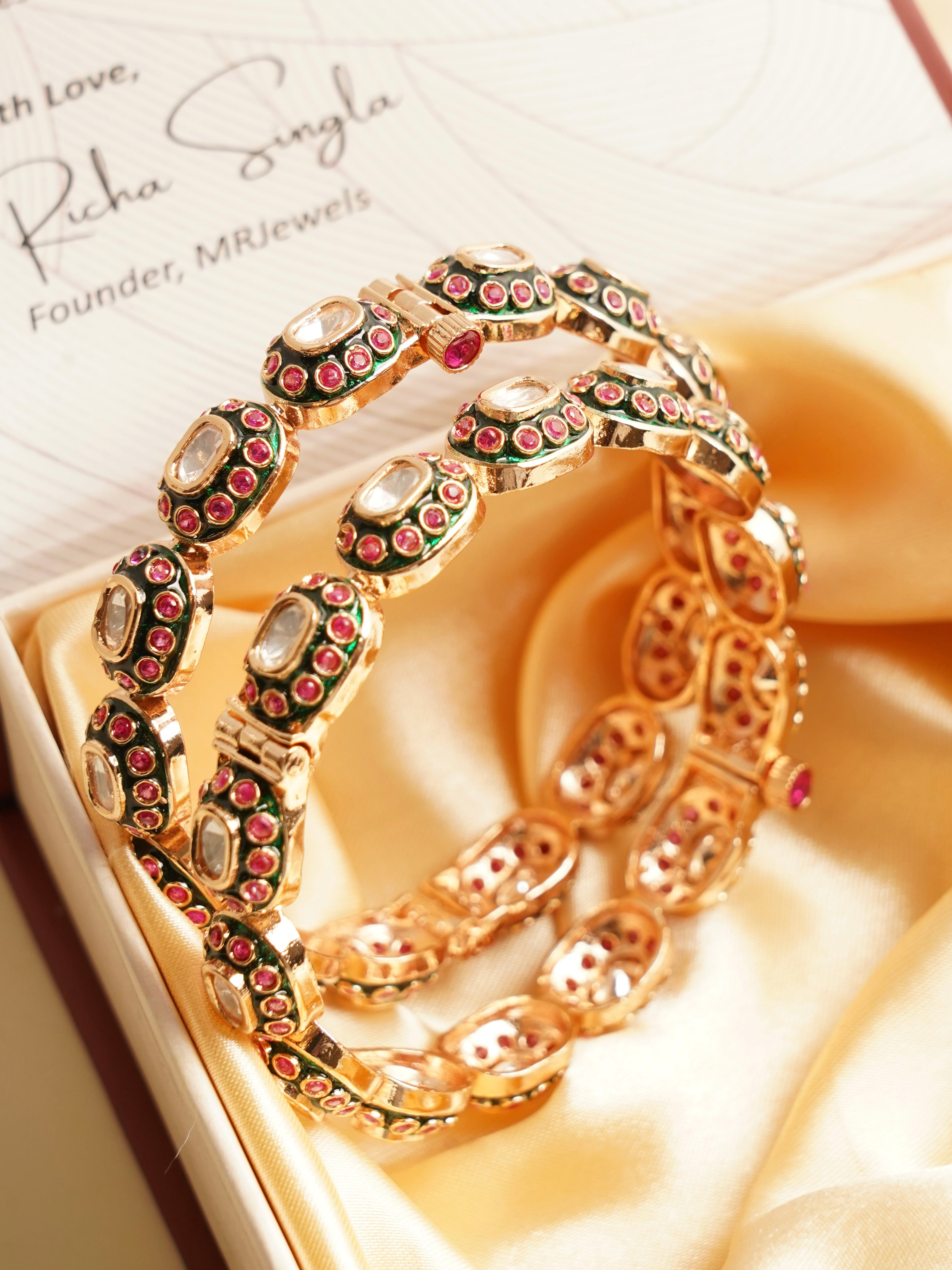 Antique gold bangles with oval design and openable clasp for traditional wear