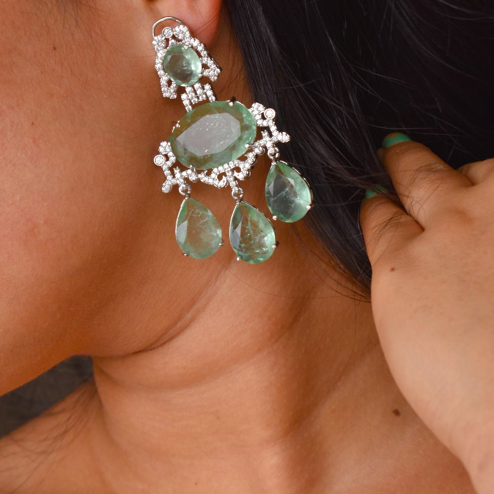 Cascading chandelier earrings with gemstone accents shown in front view