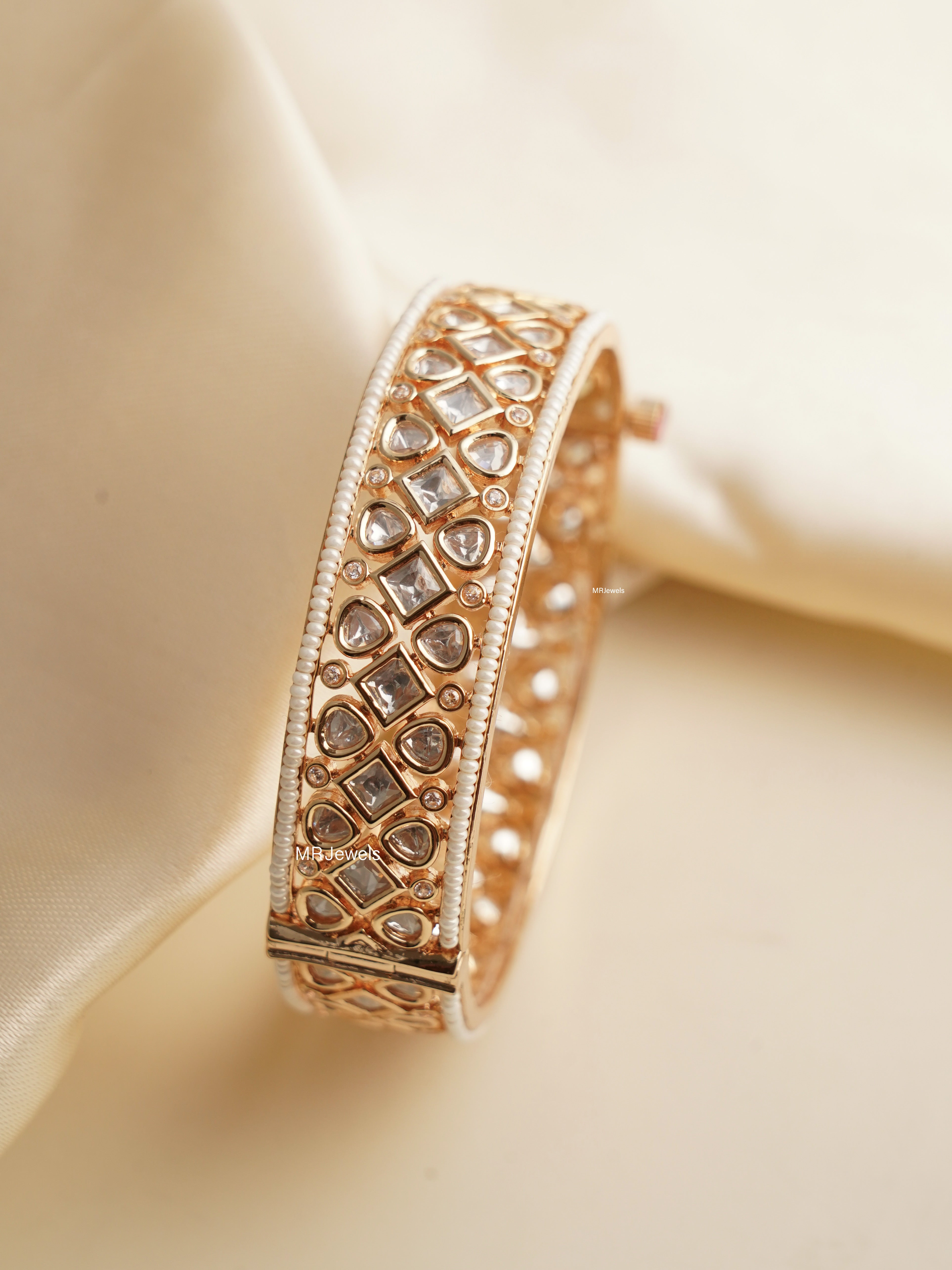 Angled close-up of polki bangle showing stone and frame detailing