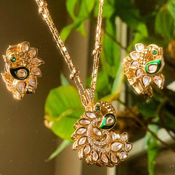 Rear view of pendant and earrings with polished gold-toned backing