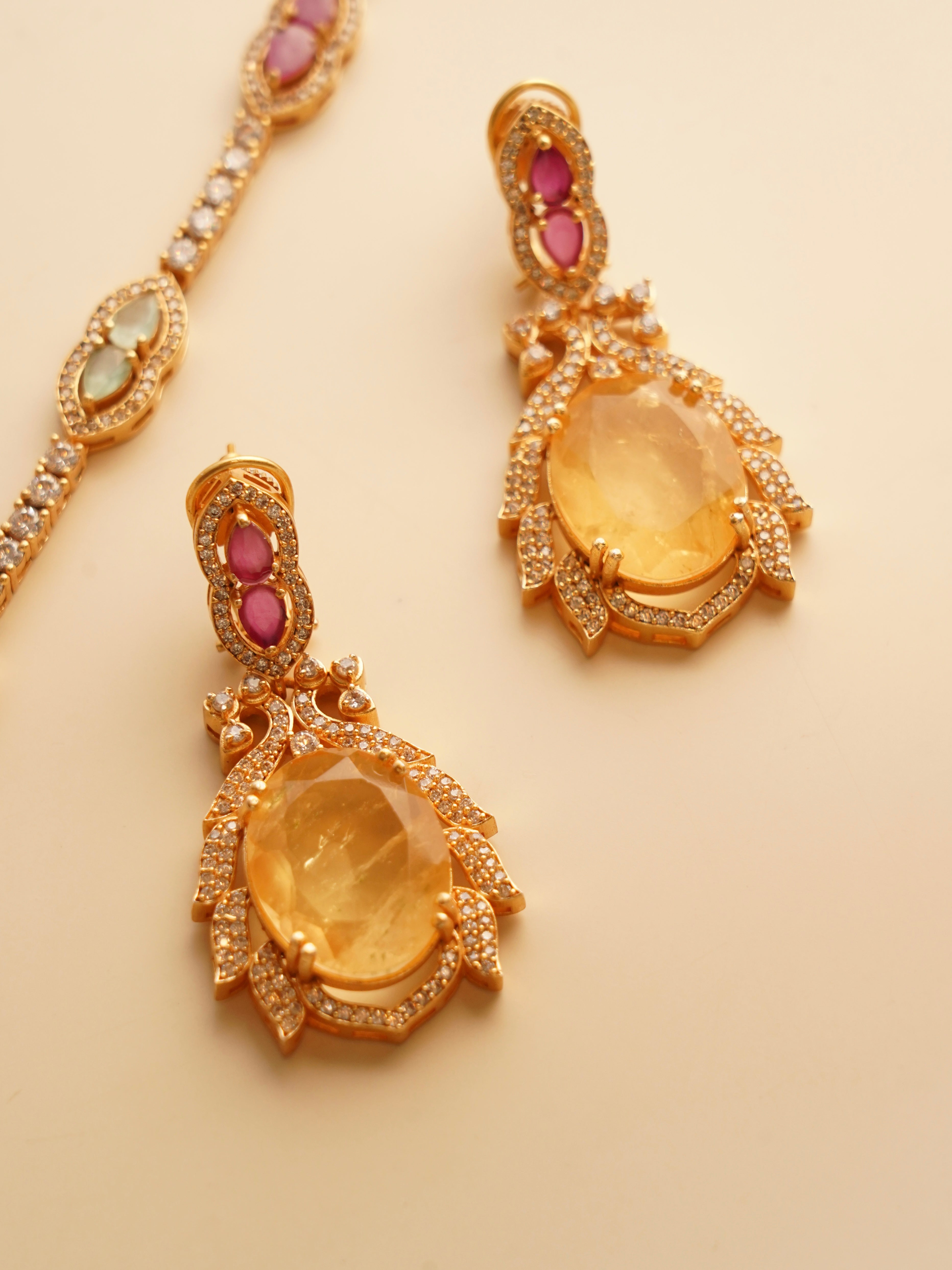 Side profile of noorie necklace on model with focus on layered motifs and curve