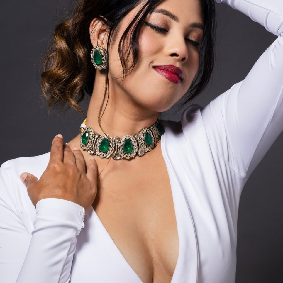 Emerald choker necklace with seven green stones in vintage-style settings