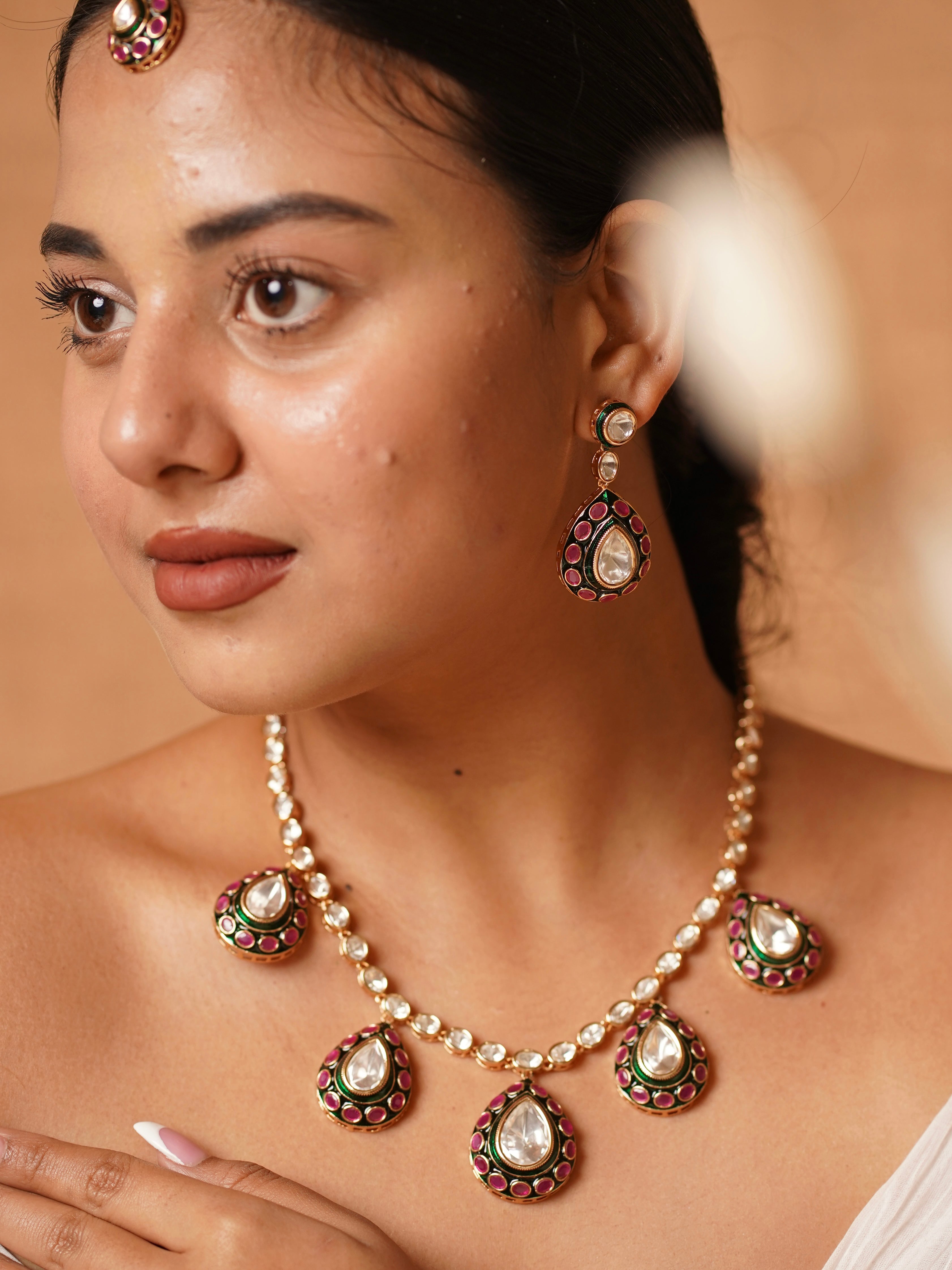 Side angle of polki meenakari necklace set highlighting detailed enamel and stones