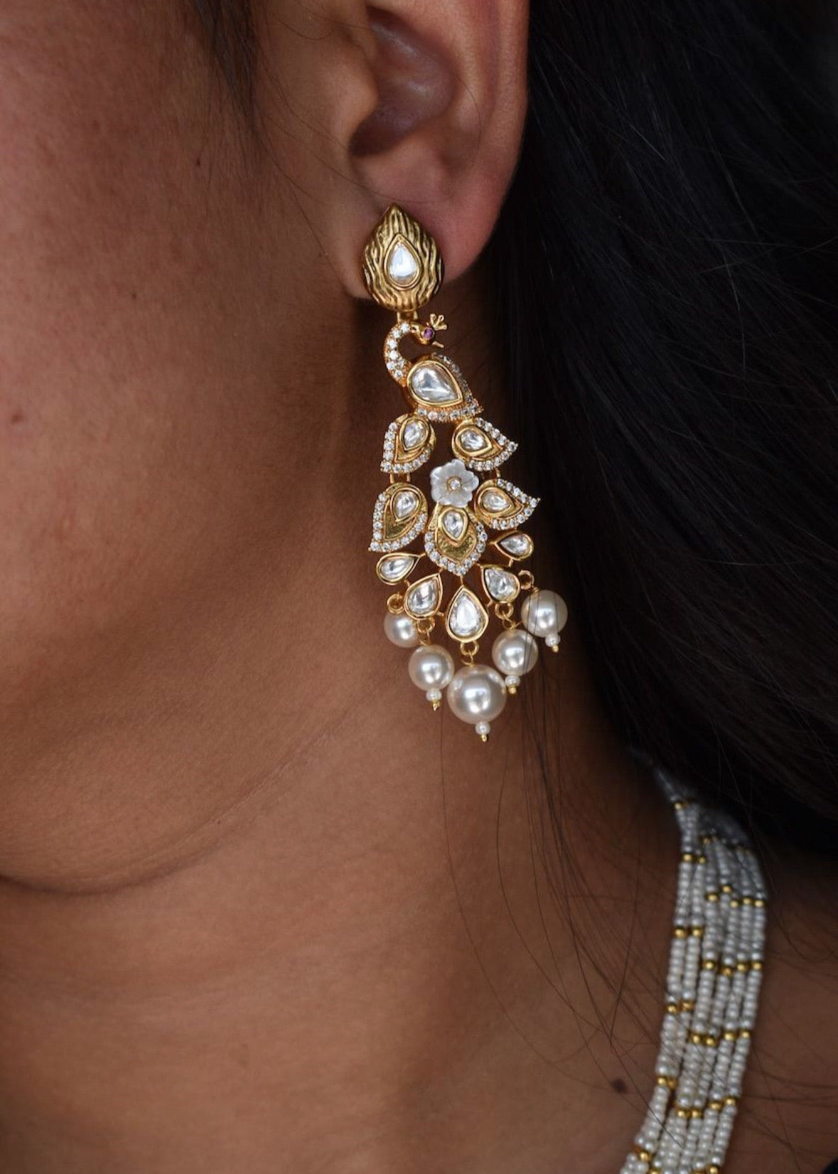 Peacock pearl necklace with kundan accents and gold-plated floral elements