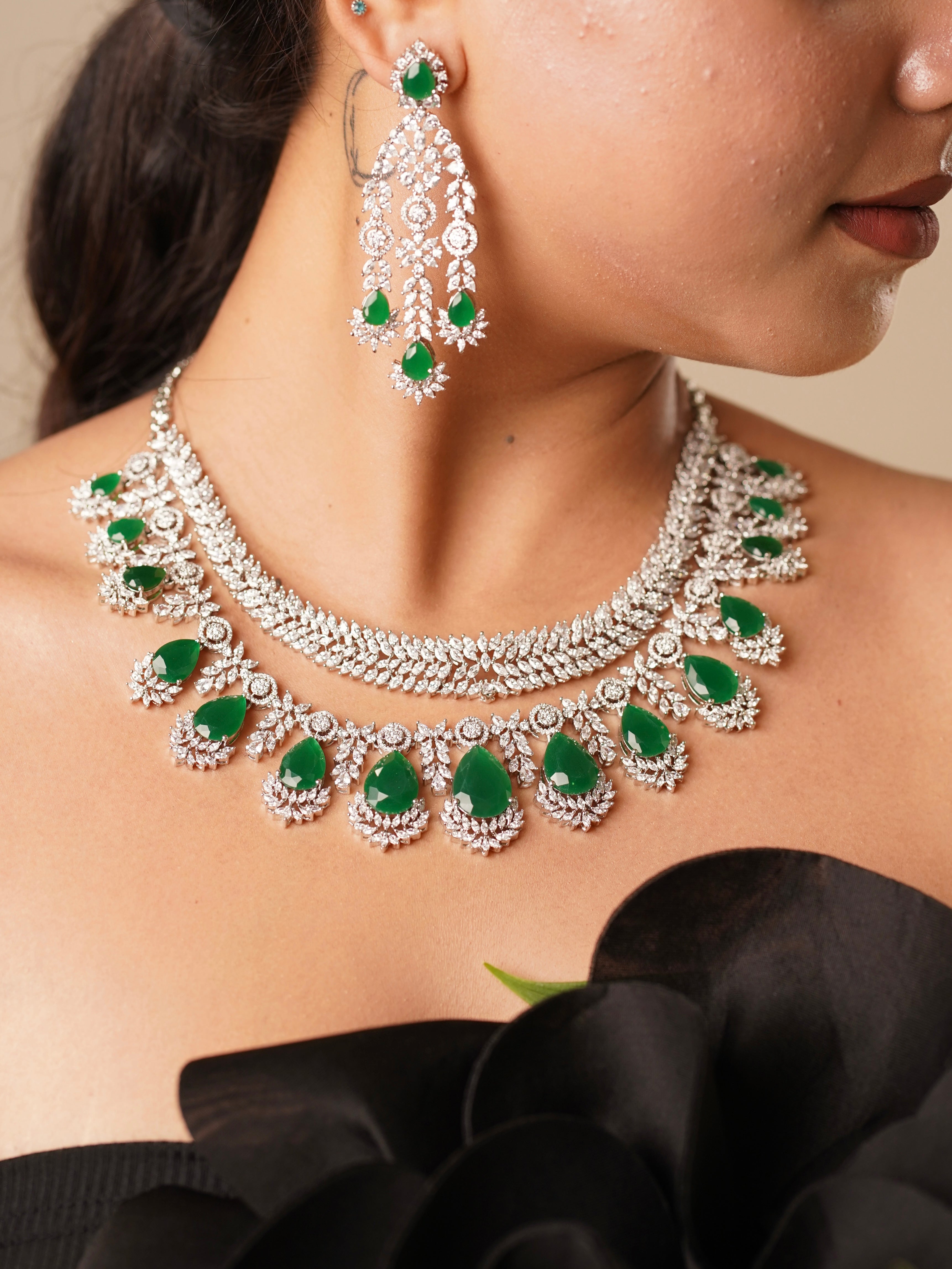 Double-layered emerald necklace set with teardrop stones and diamond-like embellishments