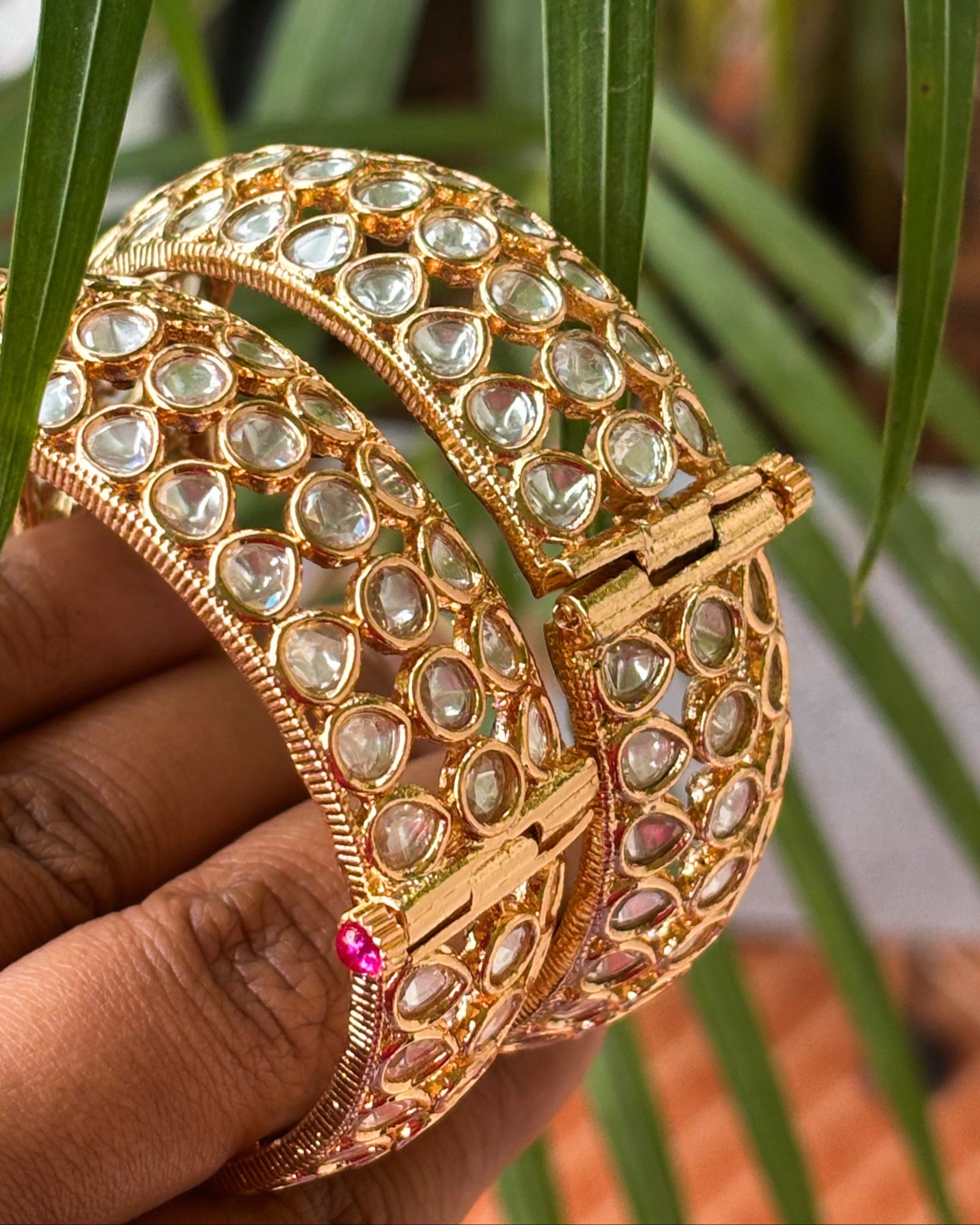 Stack view of Ruhani kundan bangles highlighting symmetrical design and gold polish
