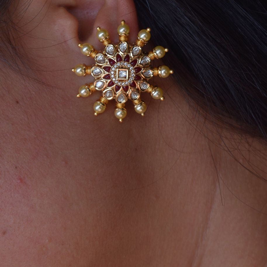 gold-plated kundan earrings with pearls and gemstone detailing in traditional style