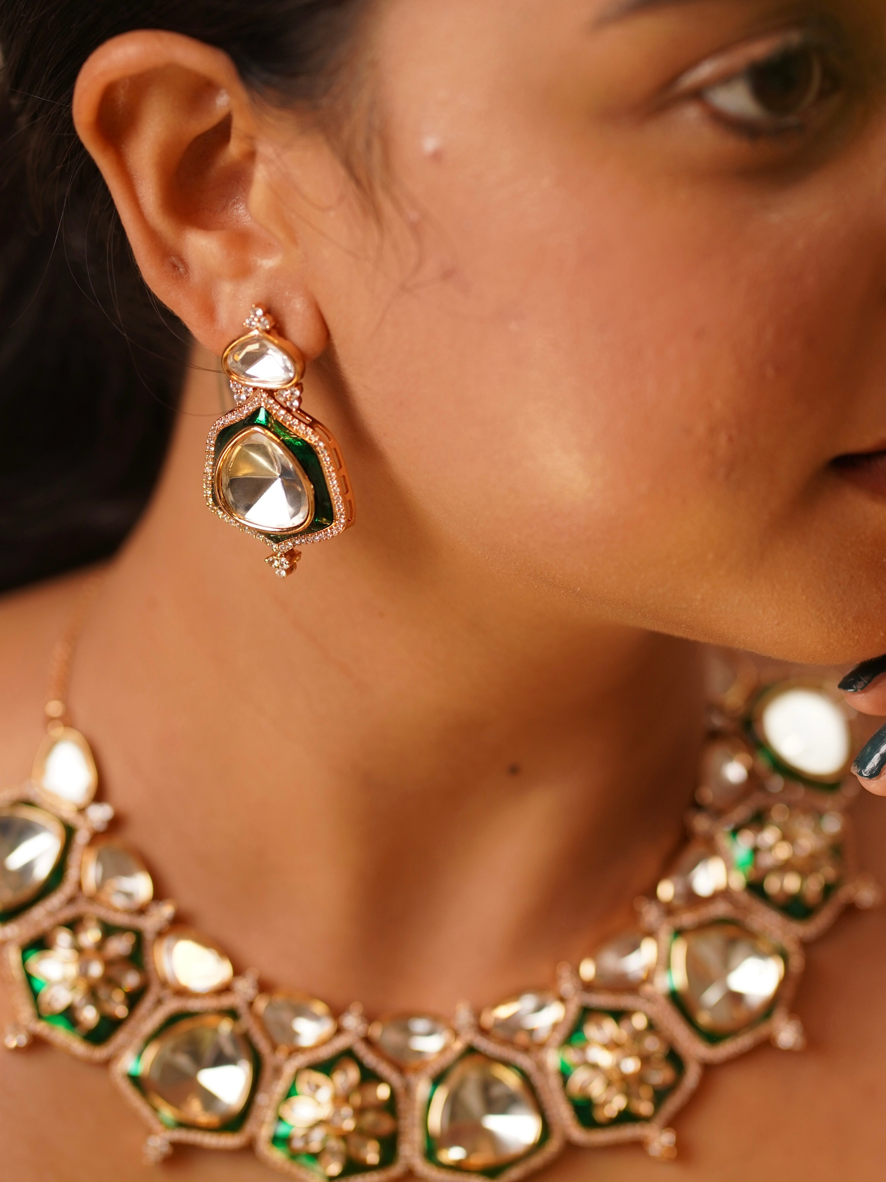 Matching earrings from heritage kundan set with polki detailing and green enamel accents