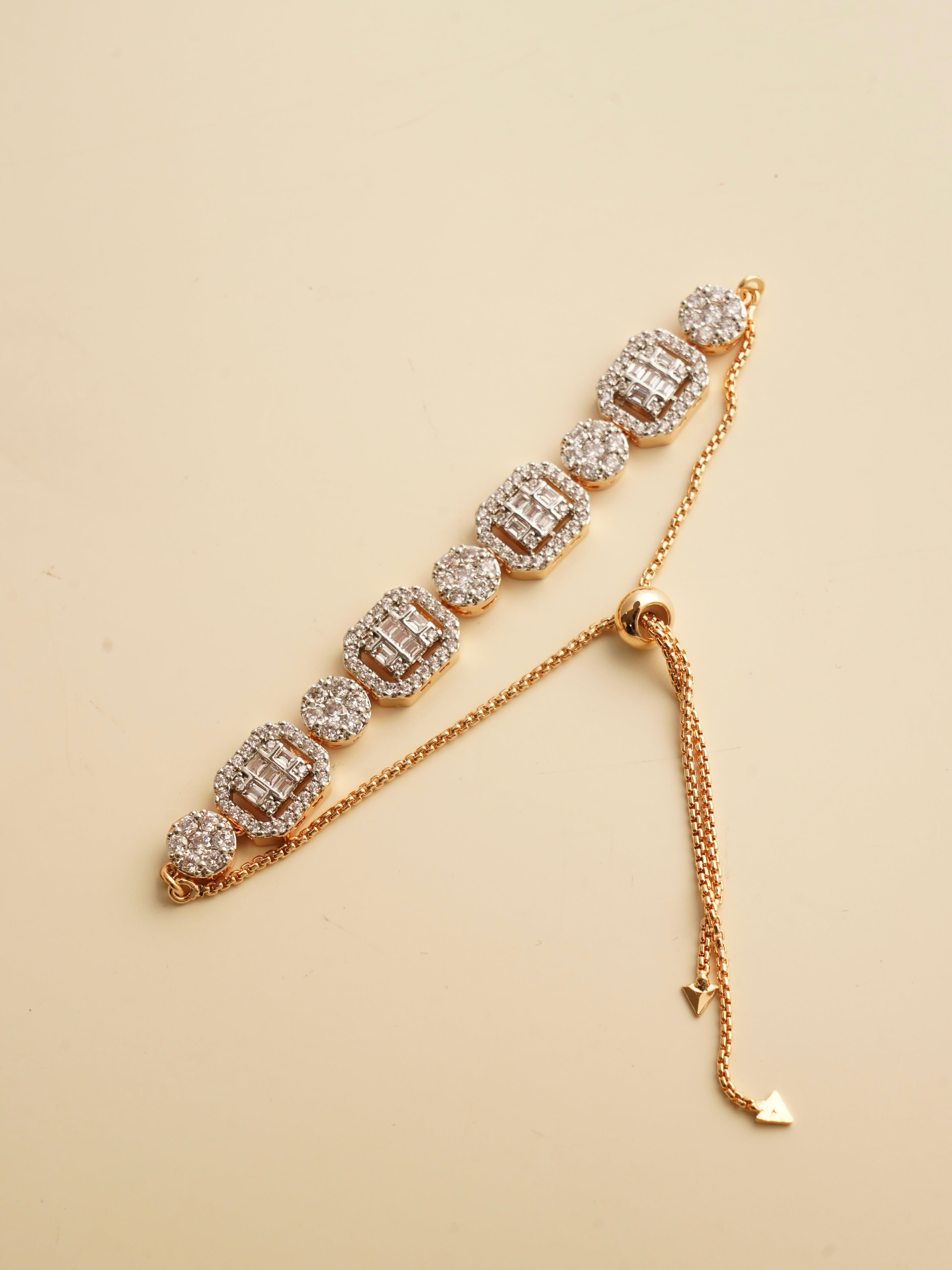 Regalia baguette bracelet with alternating baguette and round-cut zircon clusters on adjustable rose gold chain