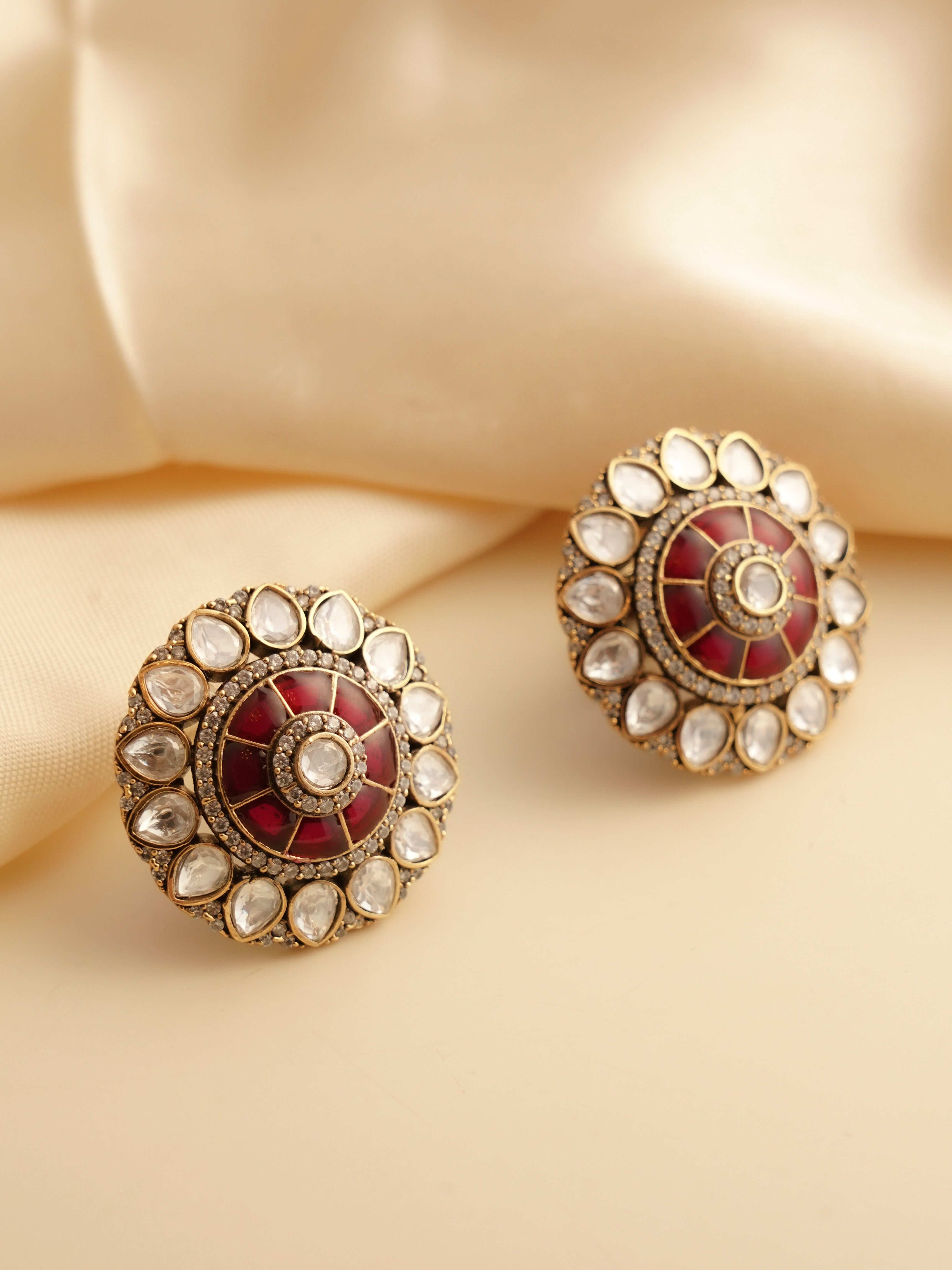 Side view of moissanite and ruby stud earrings with radiant gemstone detailing