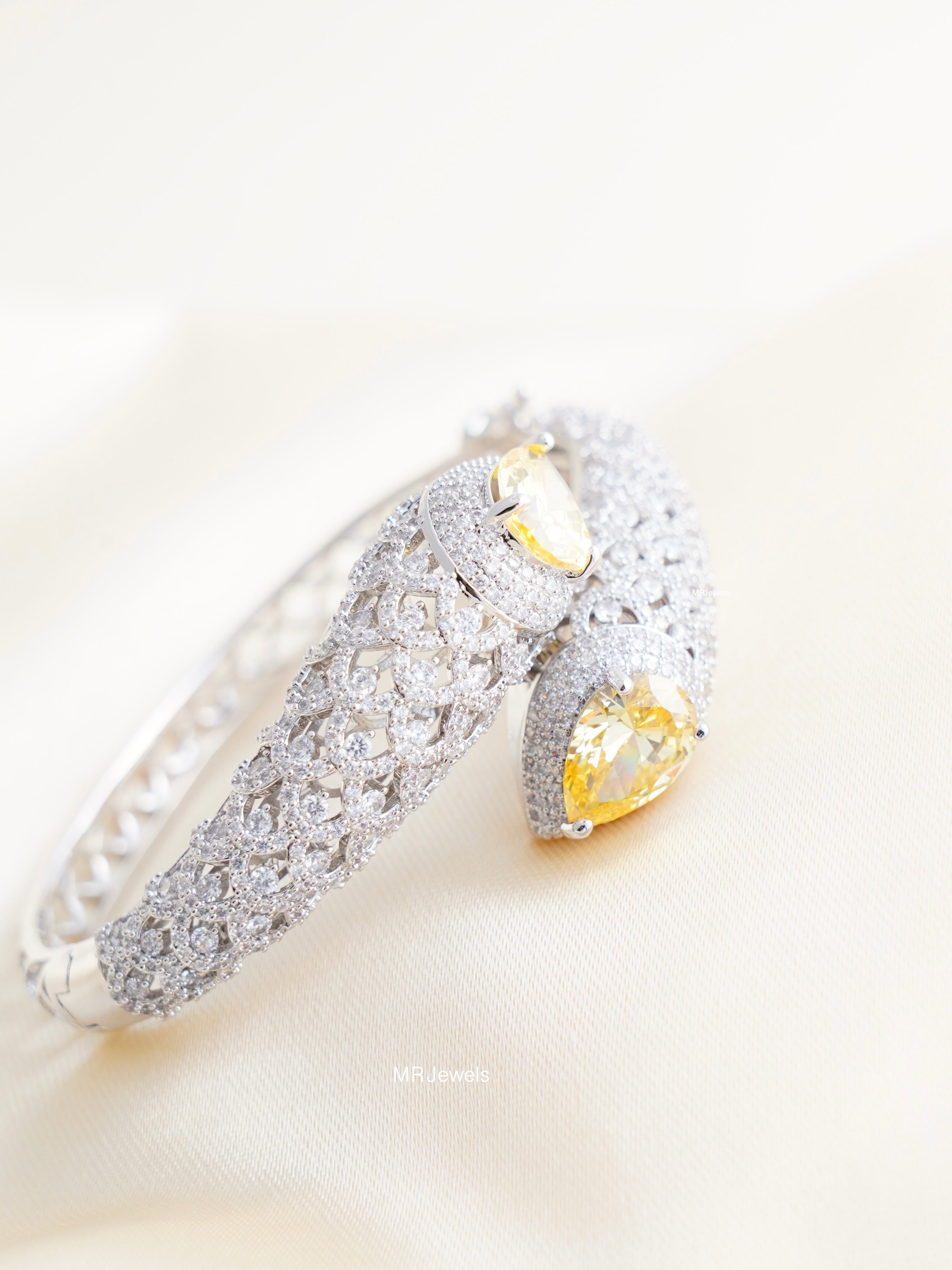 close‑up of amethyst pear duo designer kada showing clasp and pavé cz lattice