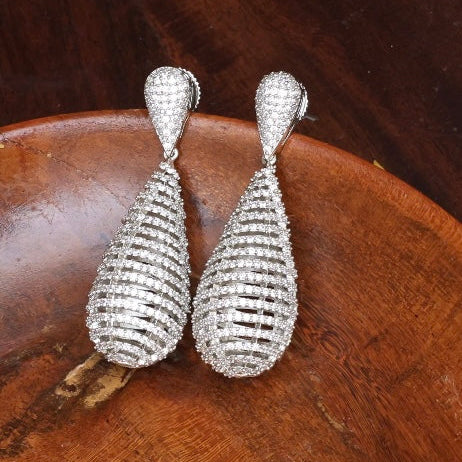 Silver-finished dangler earrings with diamond accents and elegant design, frontal view
