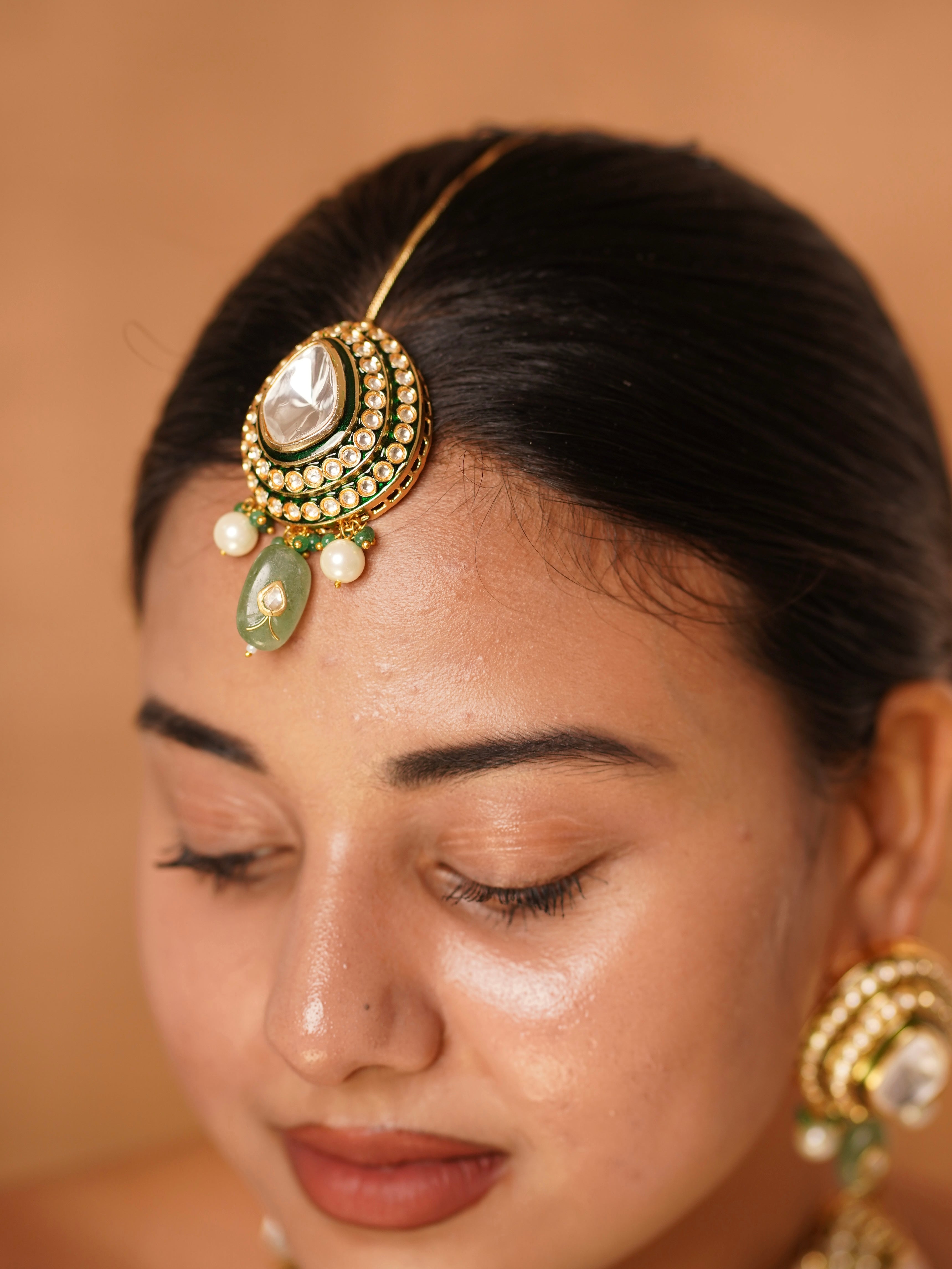 Close-up of pearl-detailed earrings from Aarohi uncut polki choker bridal jewellery set
