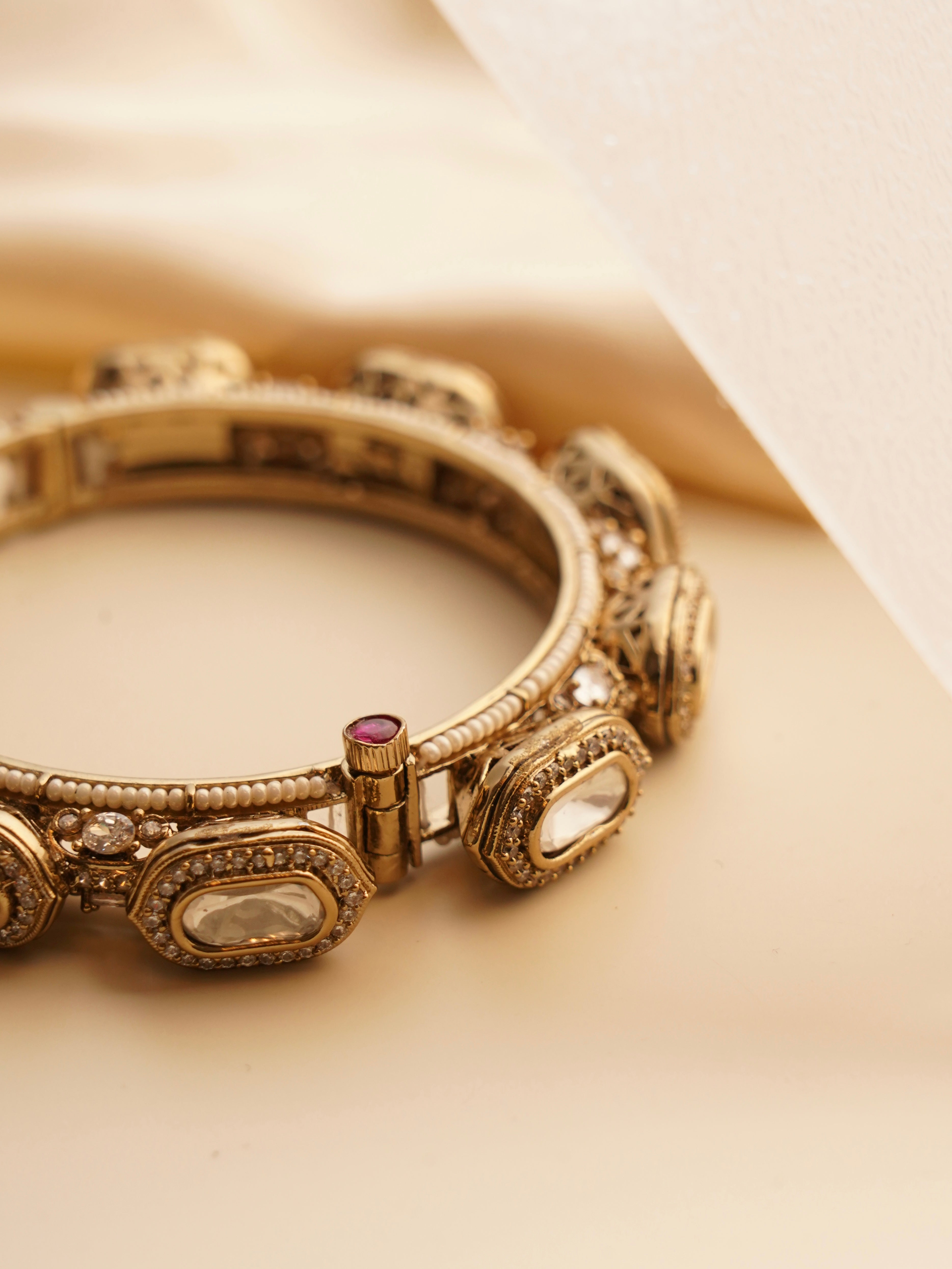 Side view of statement bridal bangles featuring regal kundan detailing