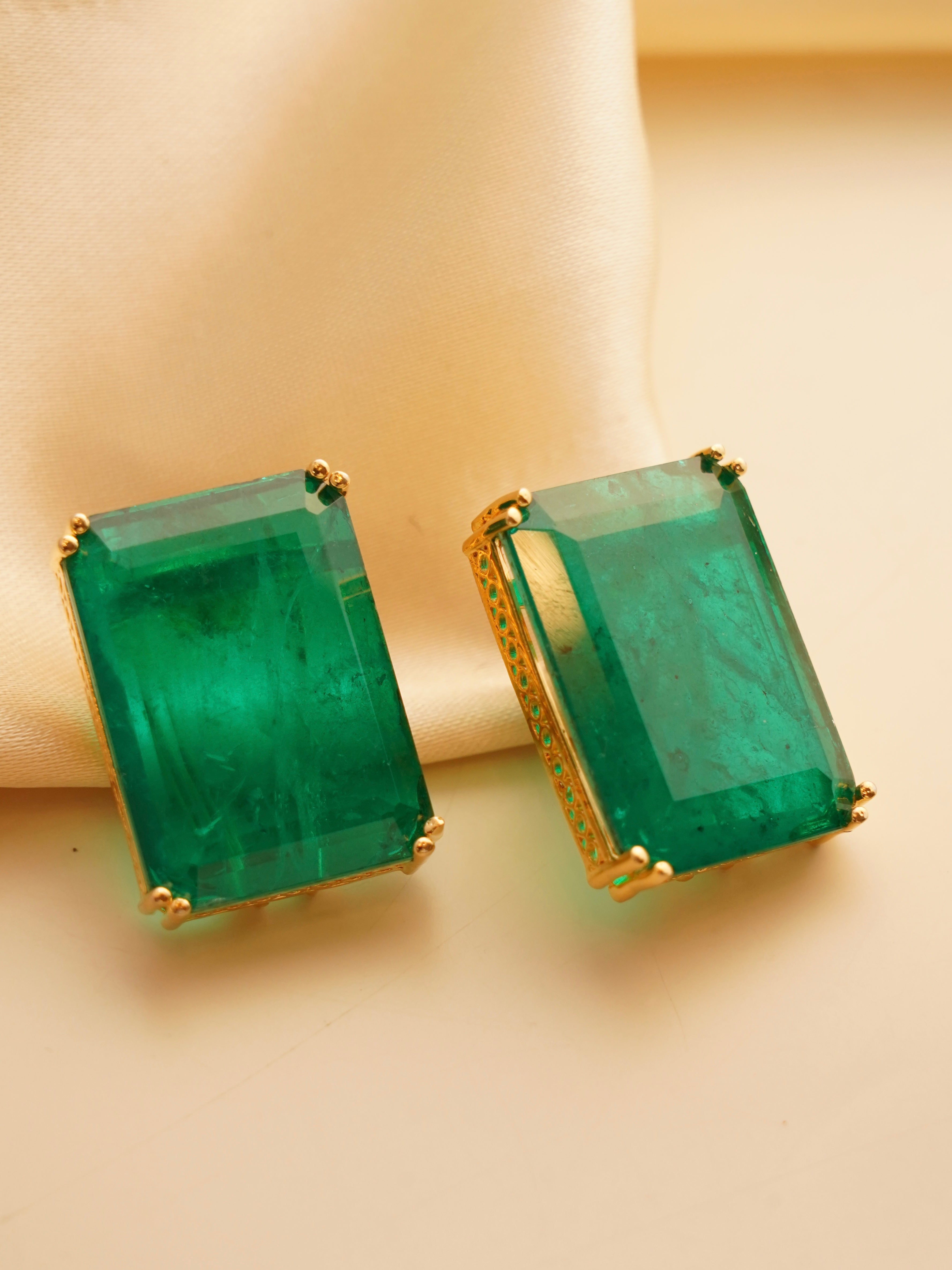 Front view of rectangular doublet stone earrings in bold gold frames