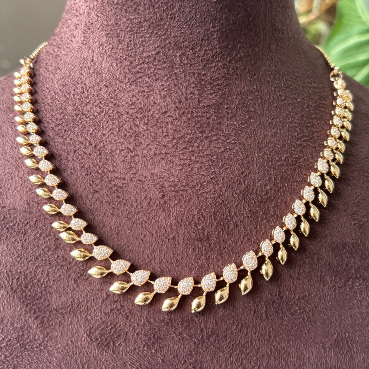 Gold plated necklace set with intricate stonework and classic design