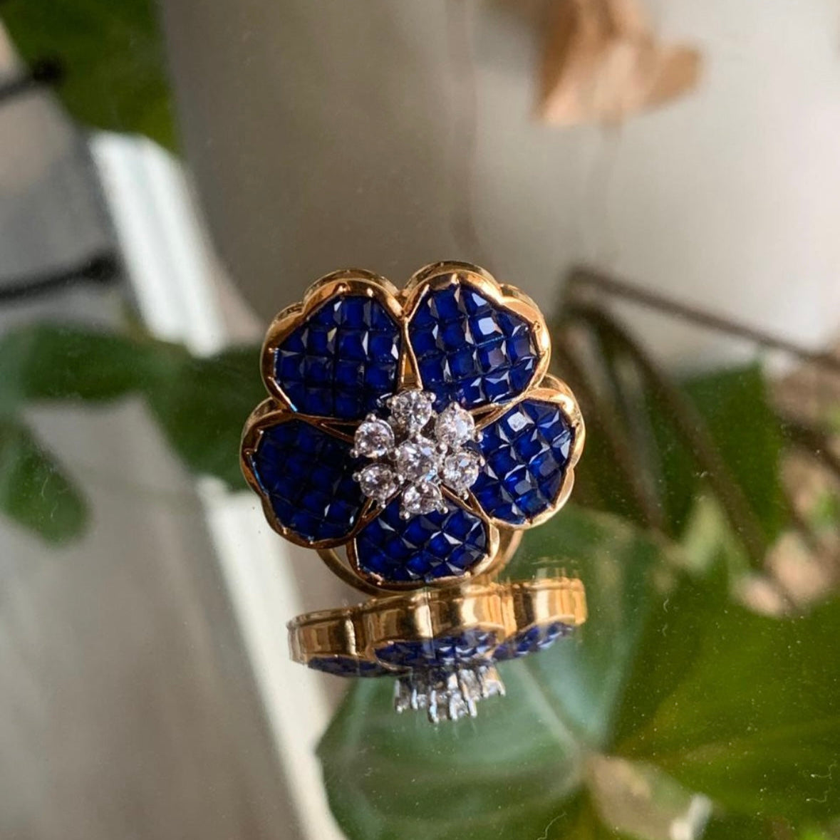 ruby flower ring with sparkling diamond accents and intricate petal arrangement