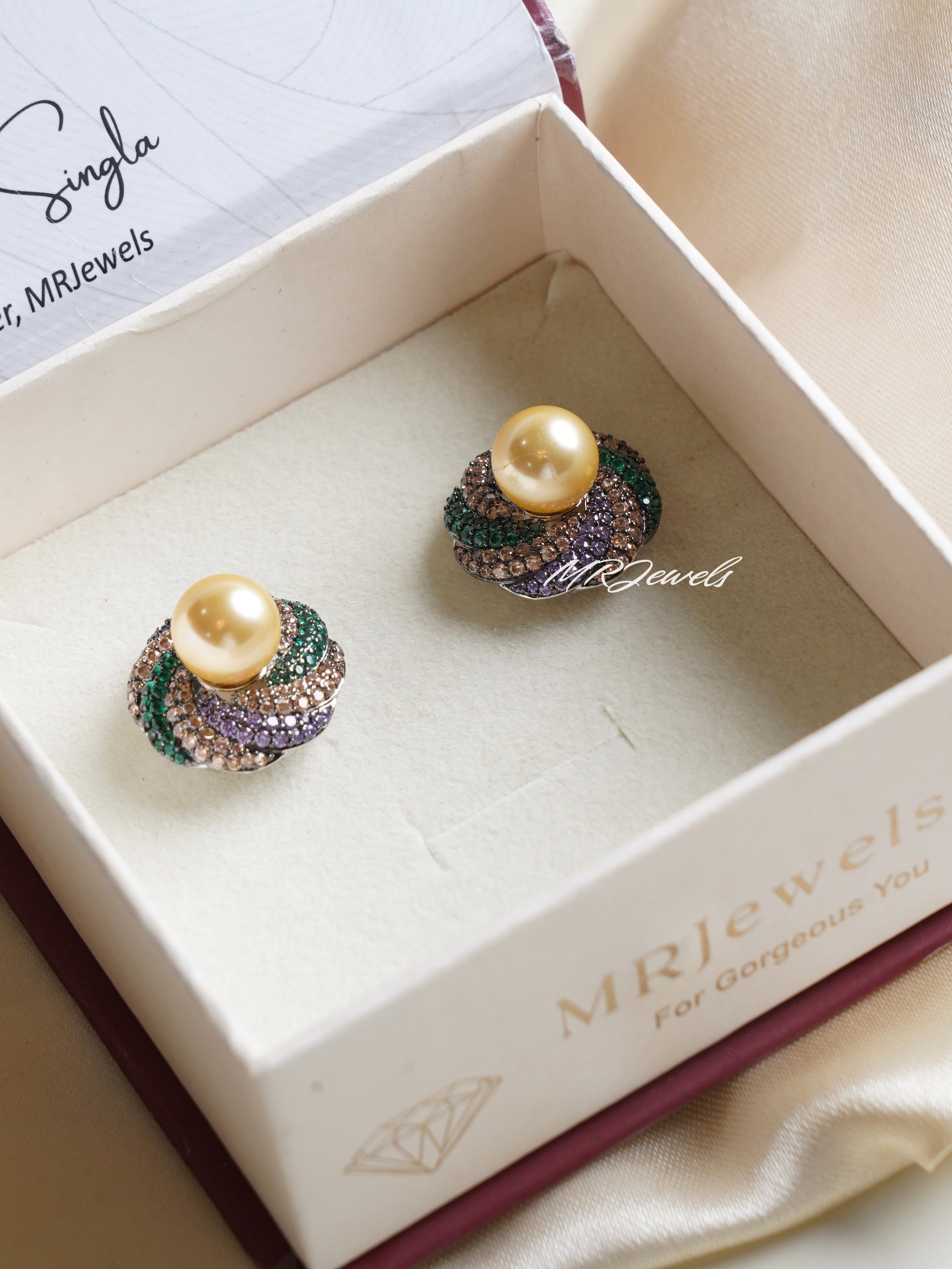 Luxe pearl dome studs featuring golden pearl center with multicolour crystal dome silhouette