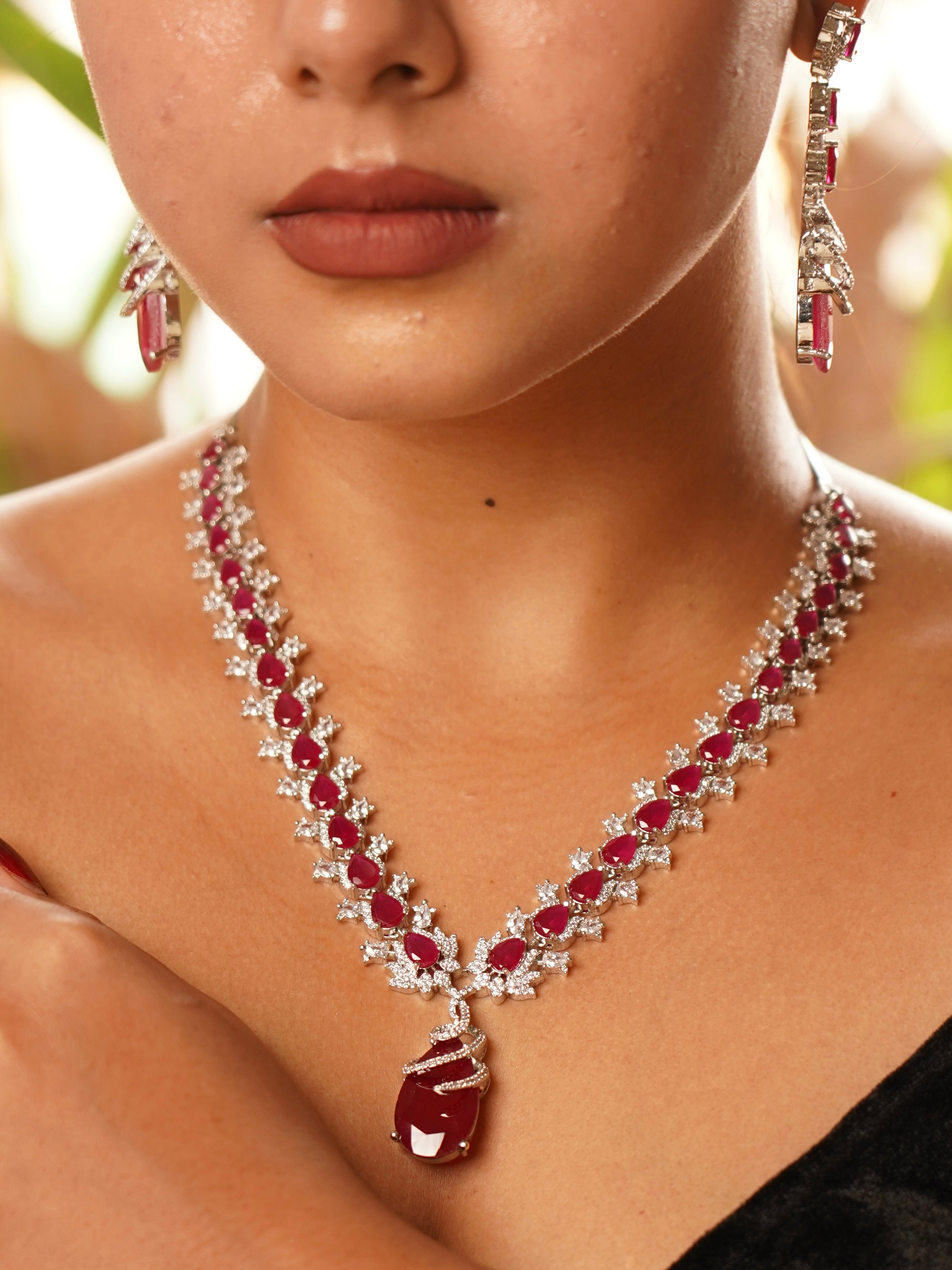 Finest quality ruby diamond necklace set with large ruby centre and diamond halo