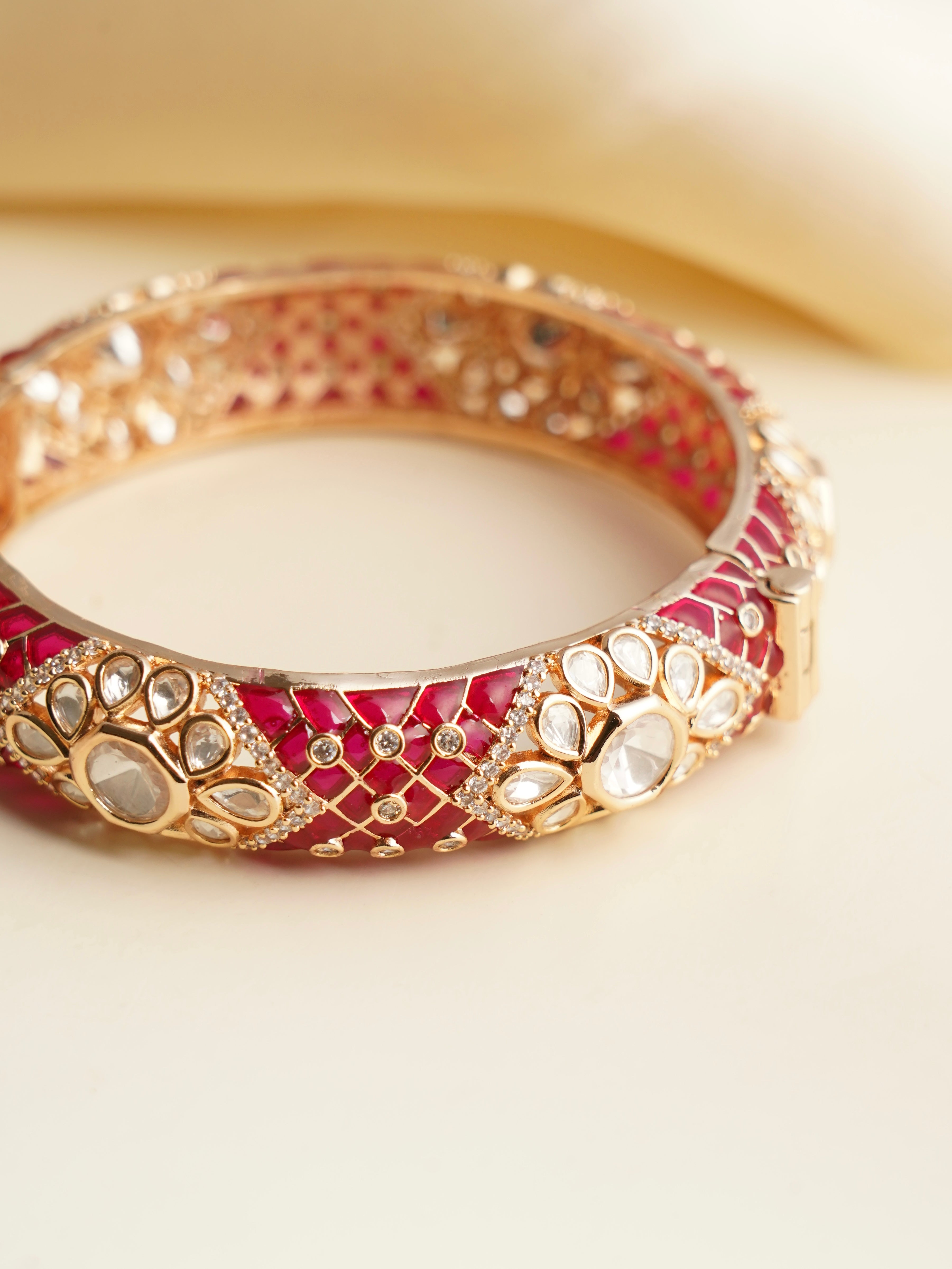 Openable kundan bangles with enamel work and polki stones in vivid traditional colors