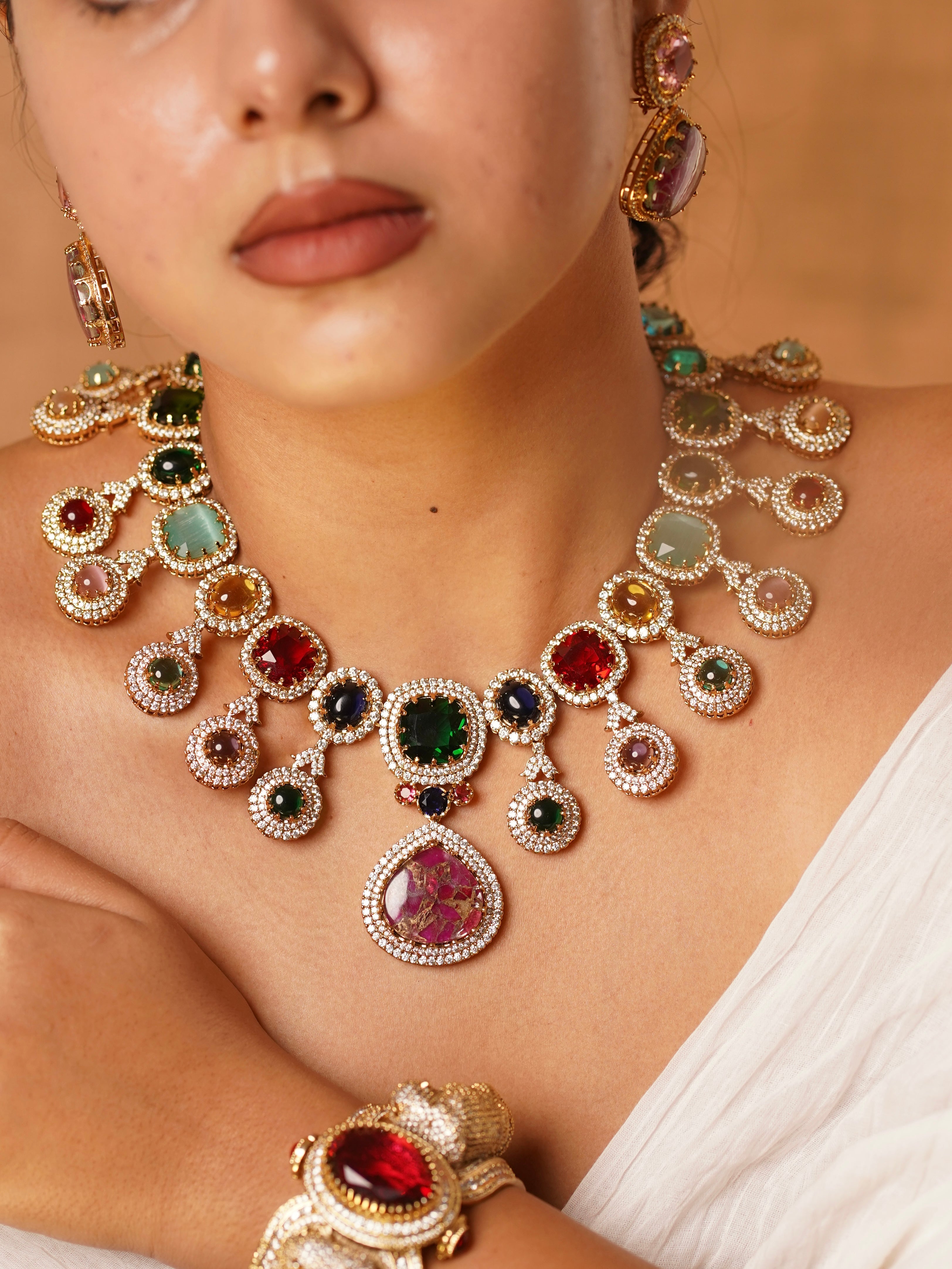 Zoomed-in view of Navratna heritage necklace highlighting uncut polki and kundan with jewel-toned stones