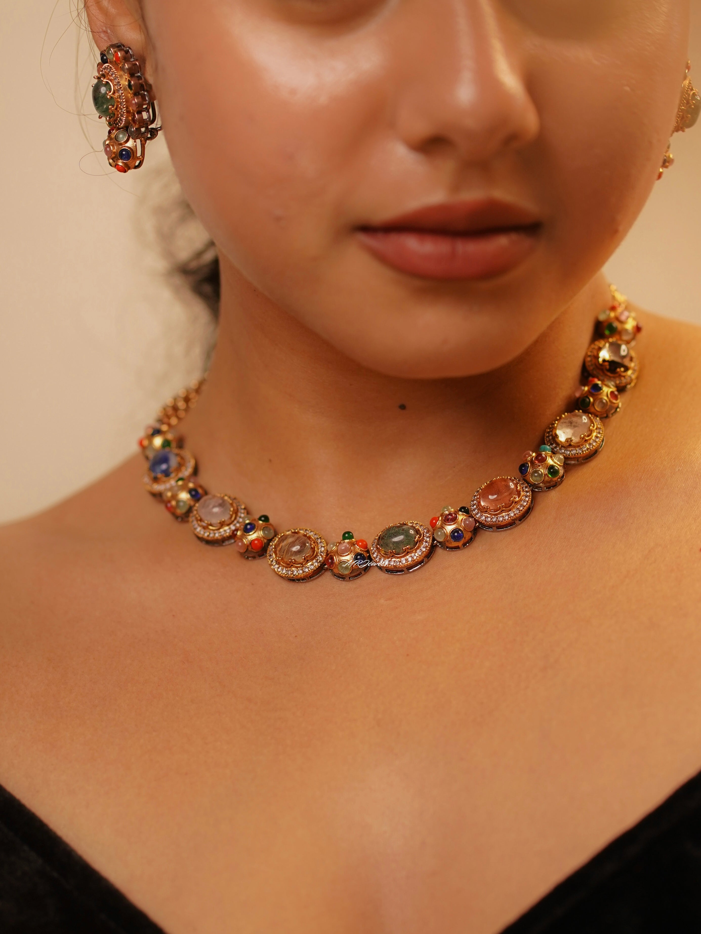 Navrattan necklace with nine multicolor stones set in handcrafted gold-plated copper base