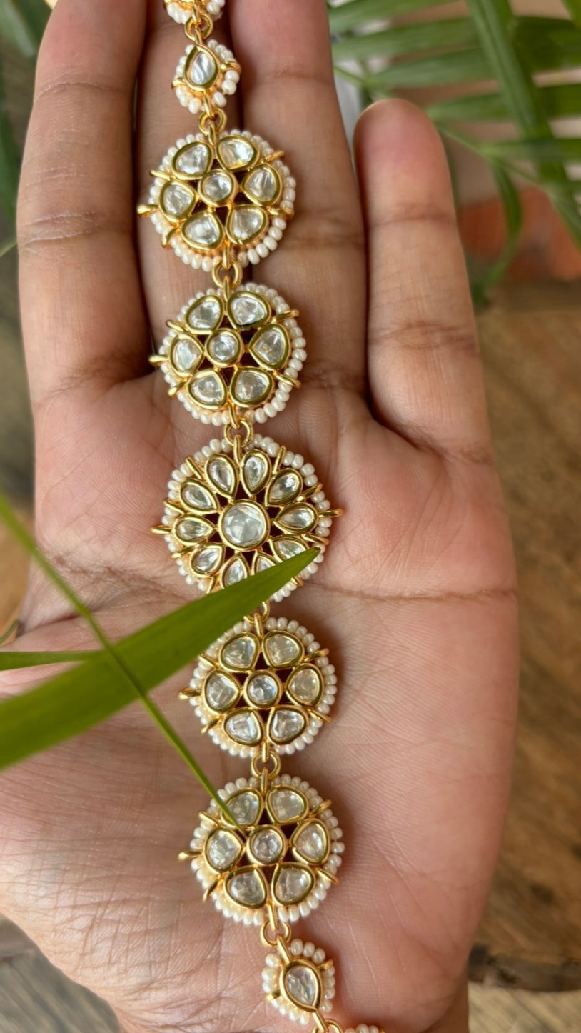 Floral kundan sheeshphool headpiece with pearl accents and intricate design