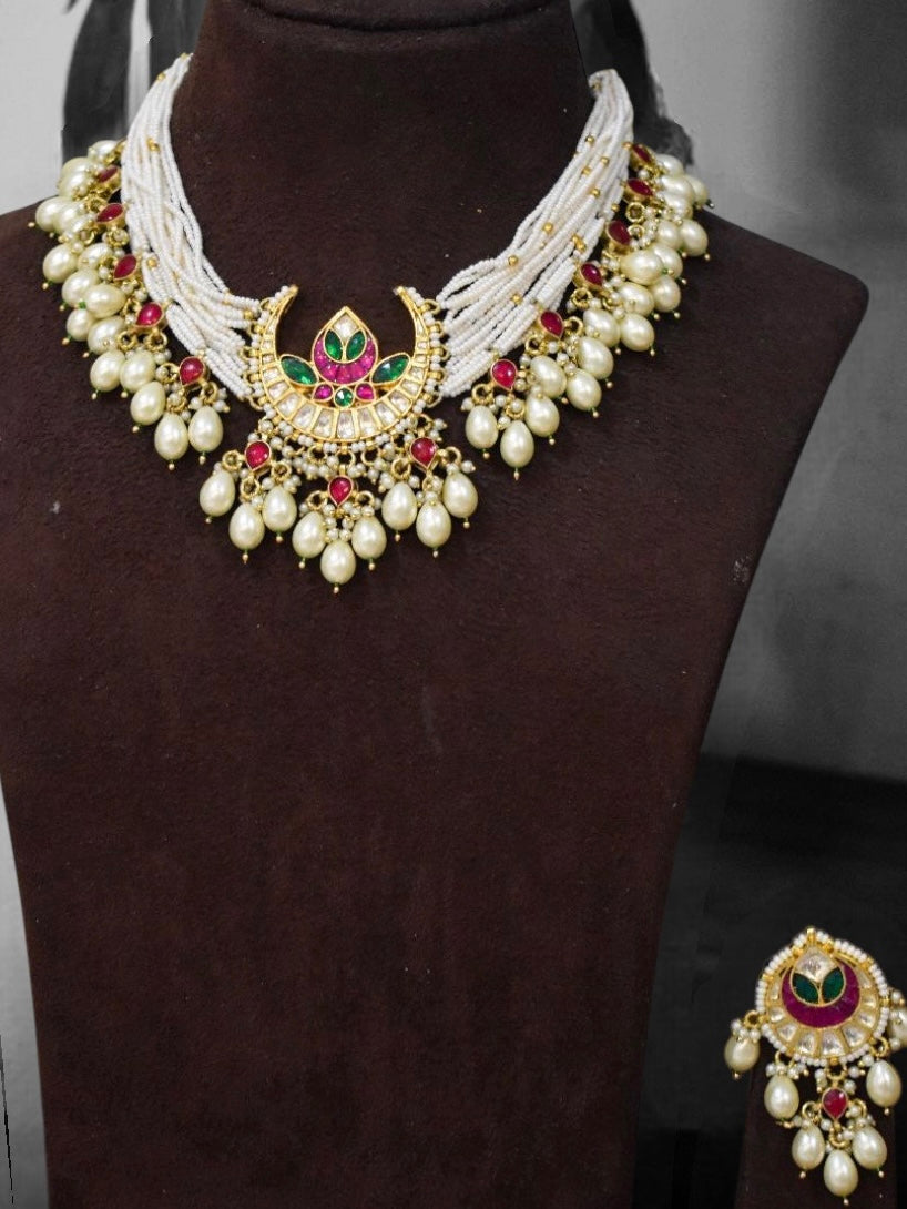 Complete view of meenakari pearl set with matching earrings and intricate traditional elements