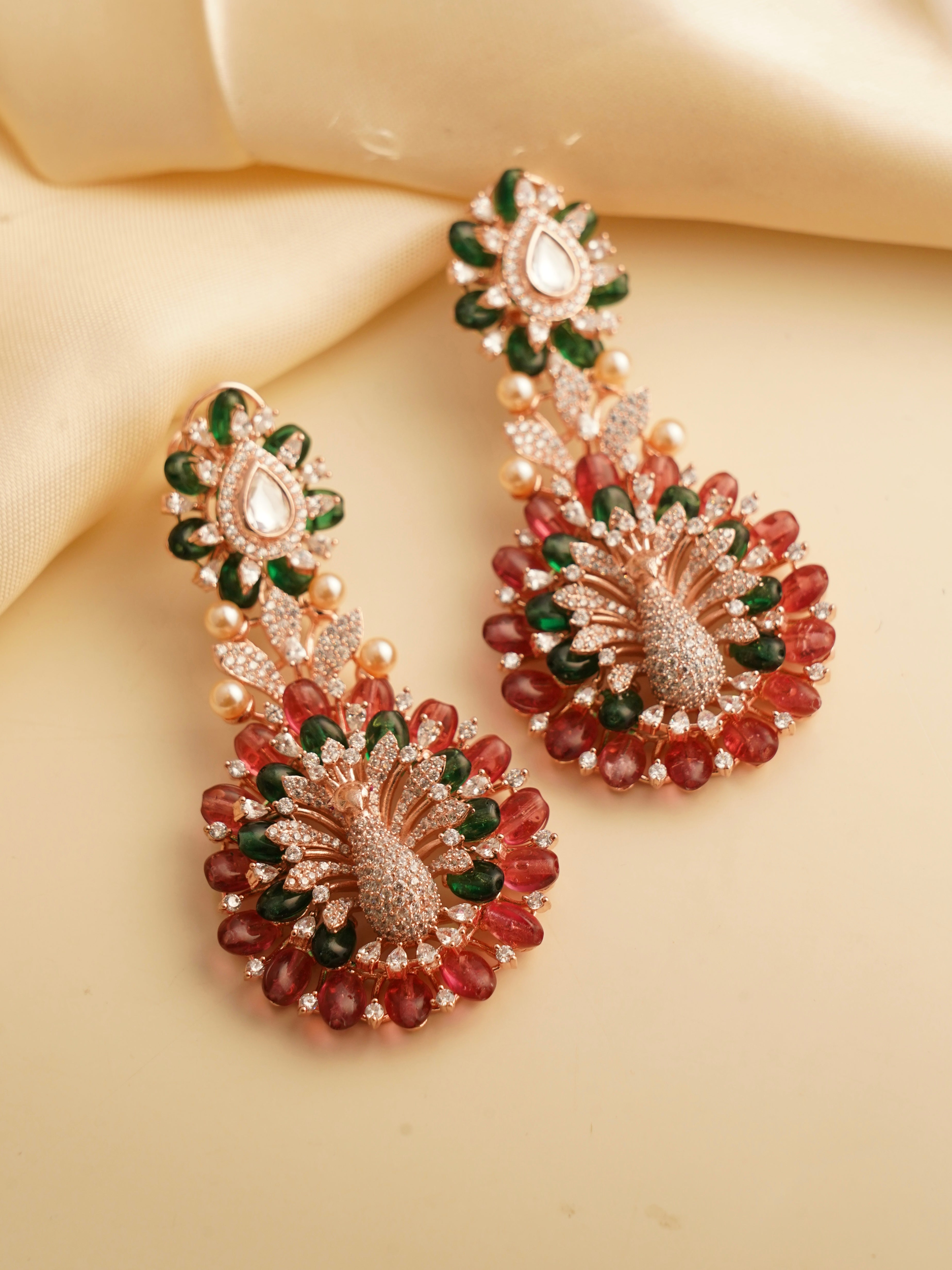 long earrings with peacock-inspired design and multicolored bead accents
