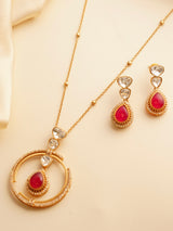 Gold-plated necklace with emerald teardrop pendant, kundan accents, and circular design