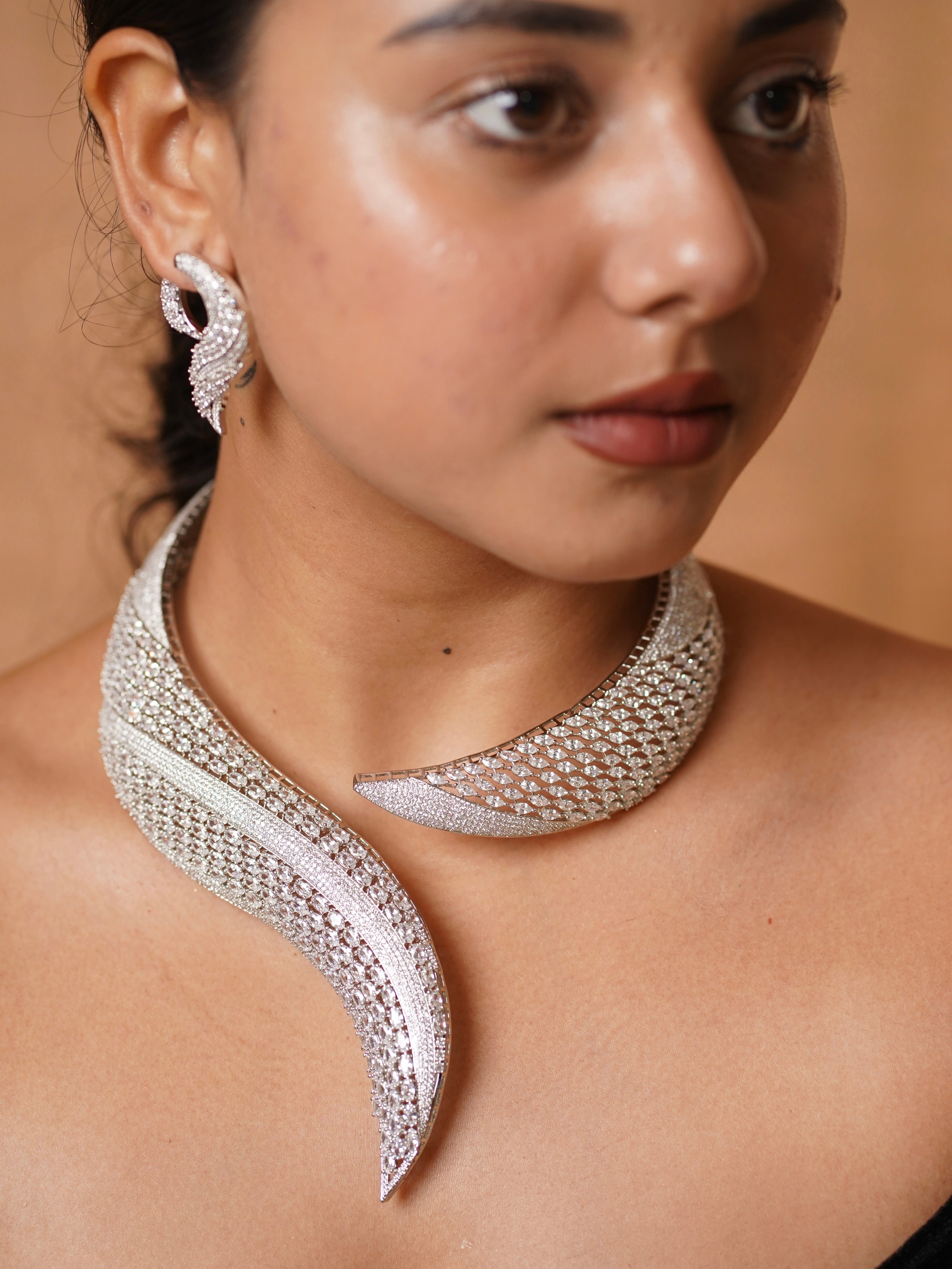 Close-up of diamond necklace set showing collar layout and intricate stone pattern