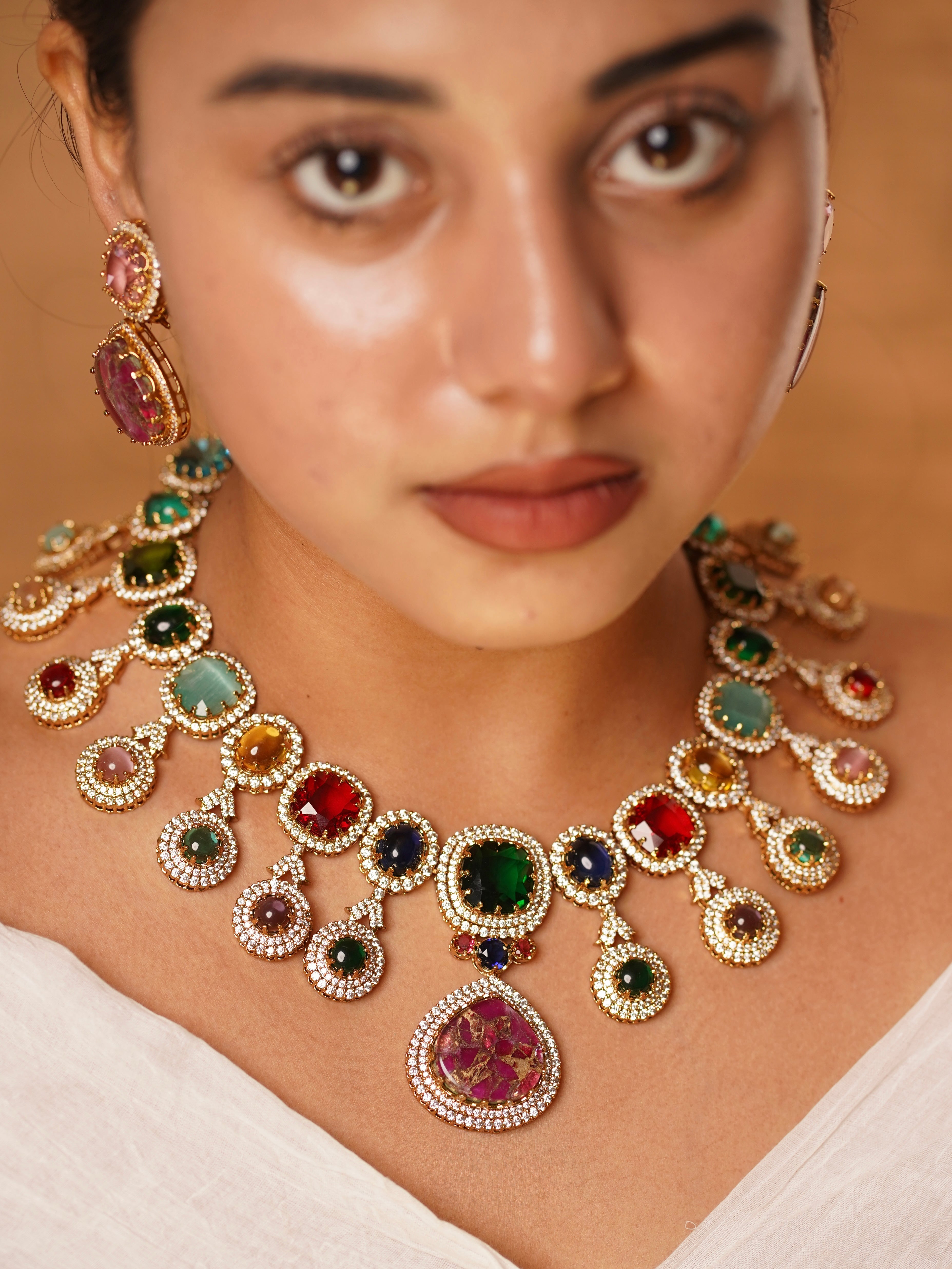 Statement earrings and kada from Navratna set, featuring intricate gold work and multicolor gemstone detailing