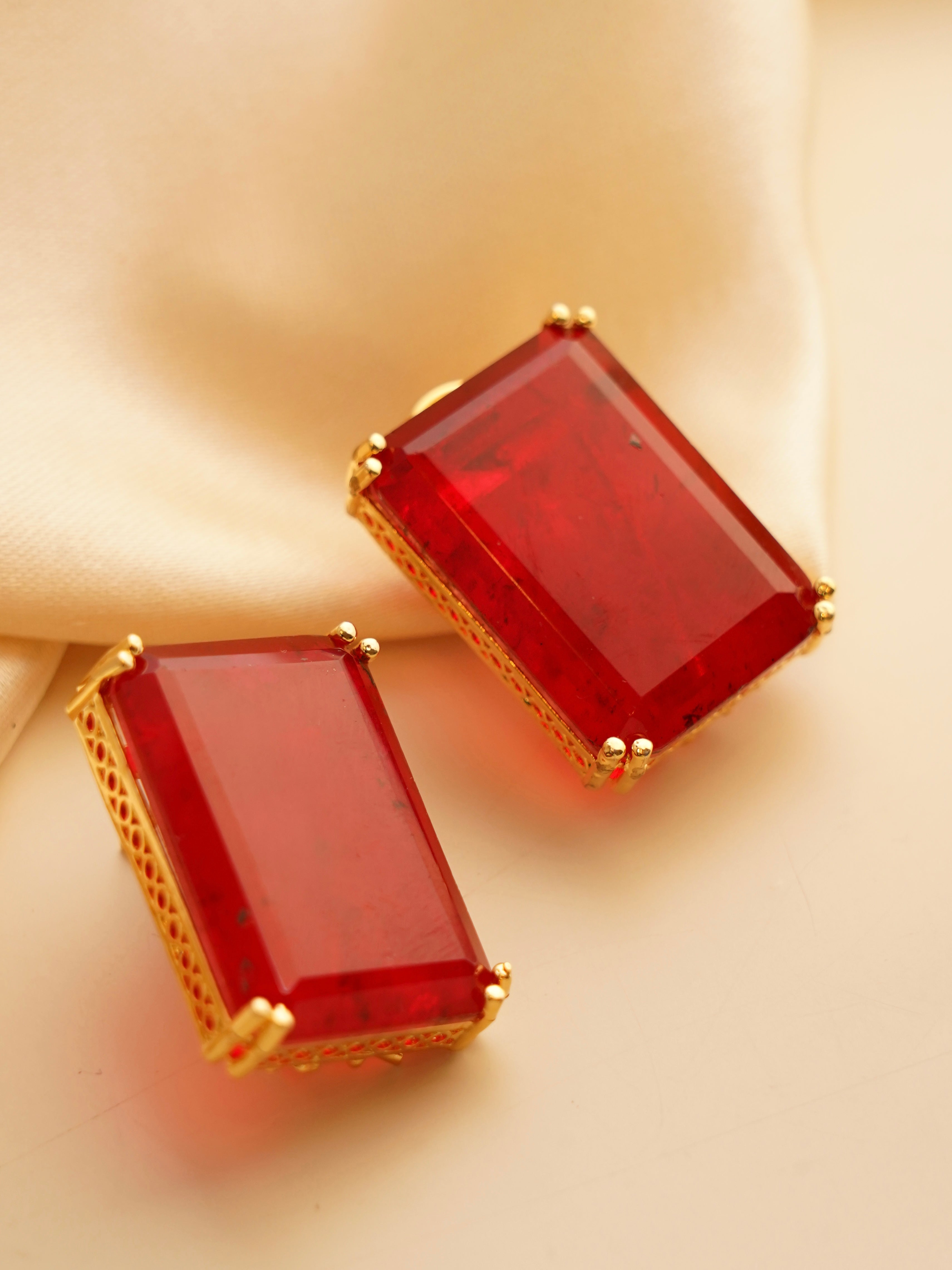 Close-up of pushback earrings featuring colorful doublet stones