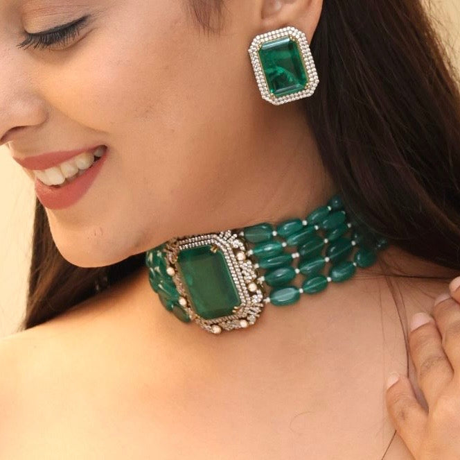 Side view of emerald choker necklace featuring premium doublet stones and matching studs