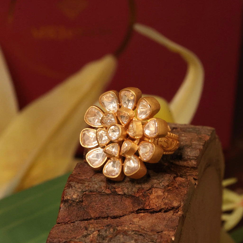 Gold-plated adjustable floral ring with layered moissanite petals in radiant finish