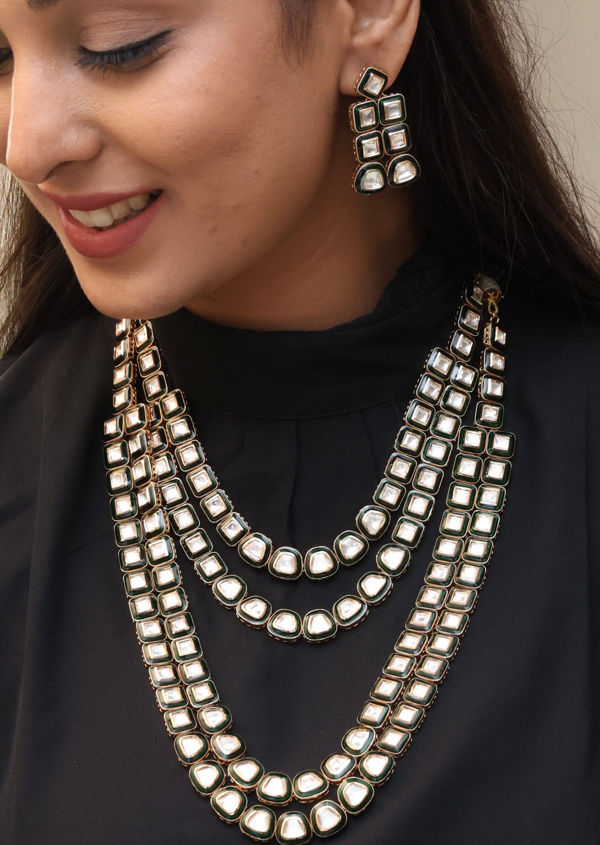 Angled perspective of necklace highlighting chain detail and polki-style centerpiece