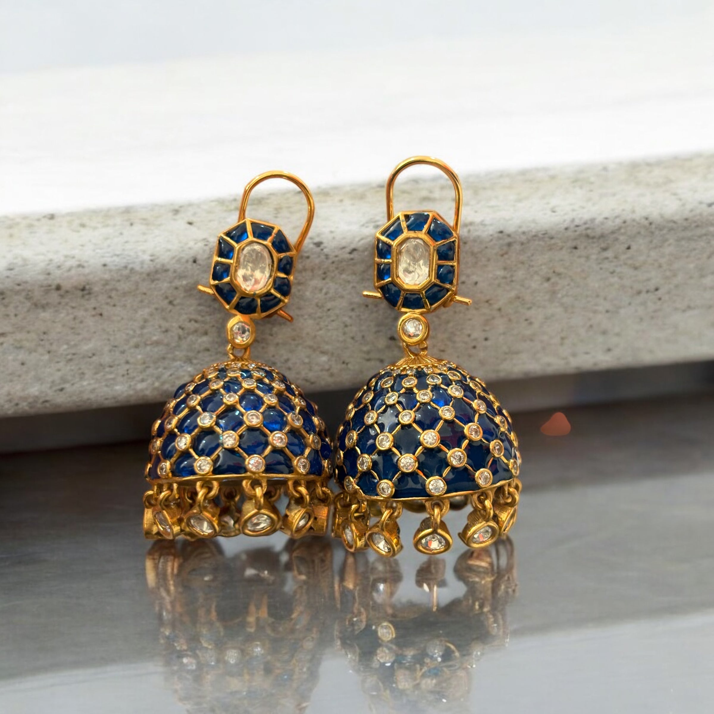 Close-up of tara jhumkas featuring turquoise hues and polki diamond embellishments