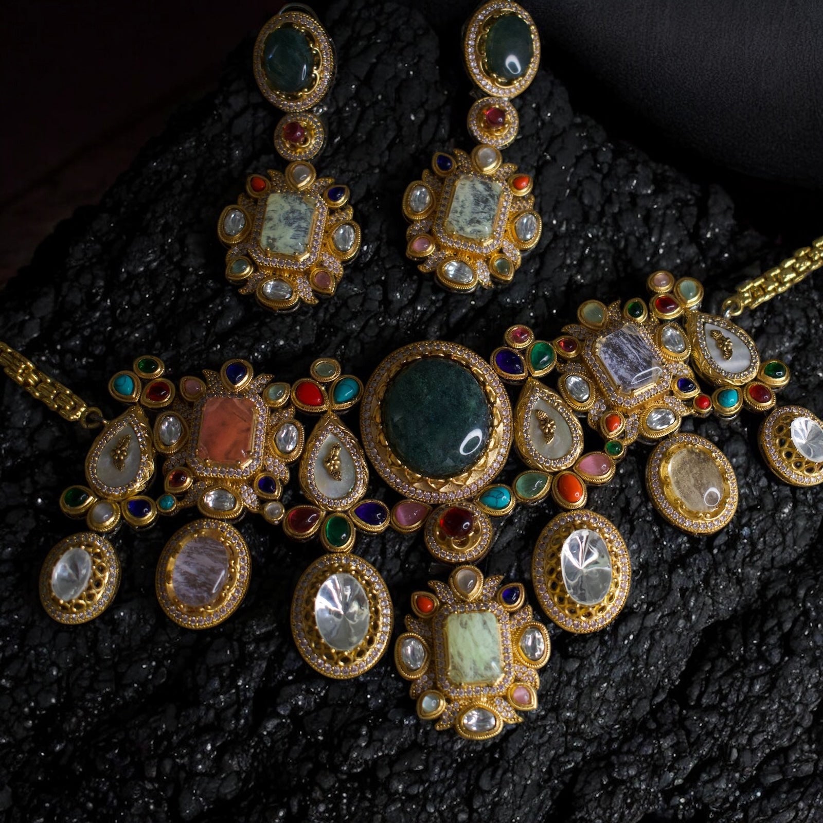 Heritage necklace set with uncut gemstones, meenakari work, and pearl accents in gold frame