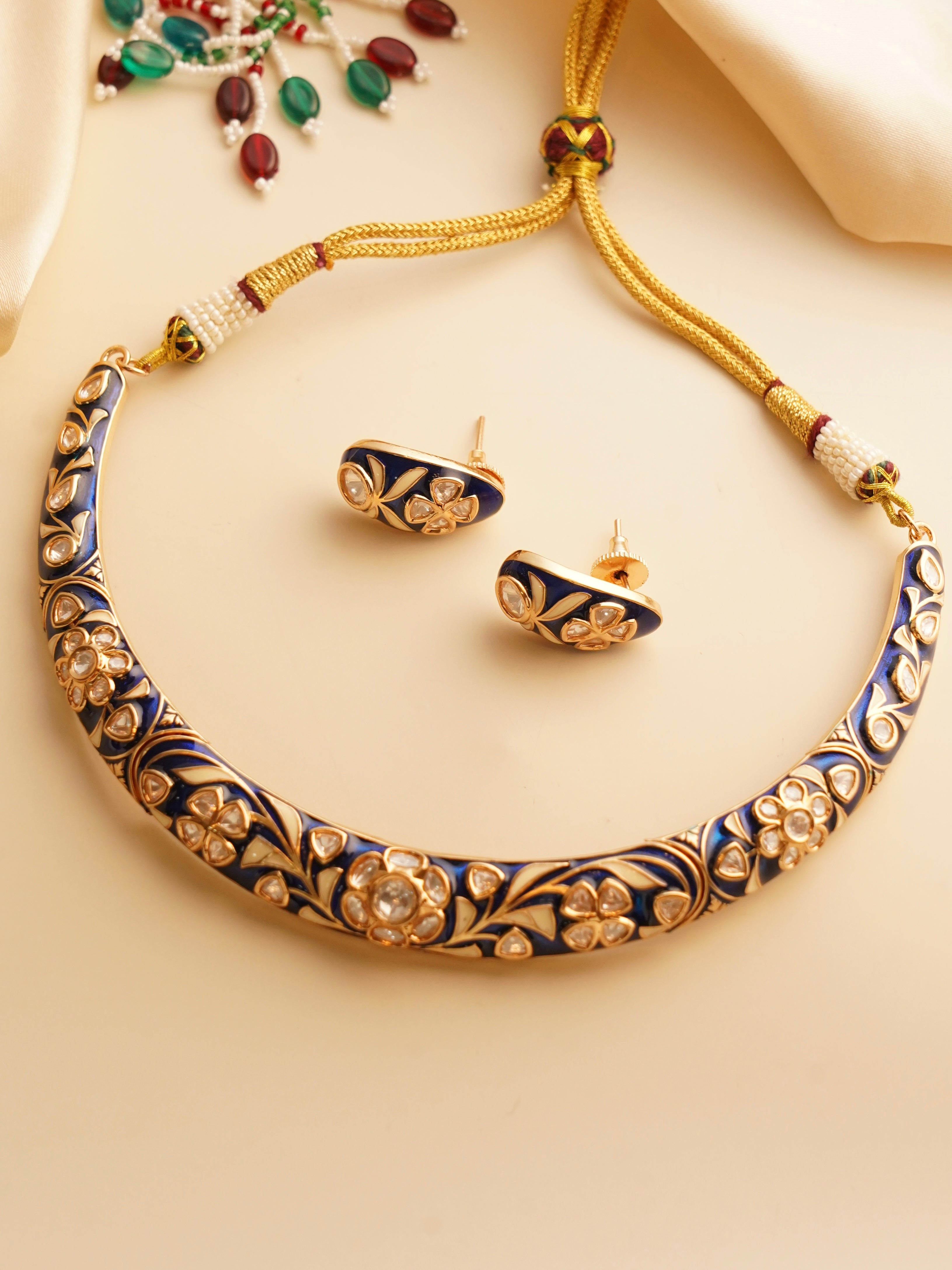 Traditional meenakari hasli necklace with multicolored enamel and gold-toned design