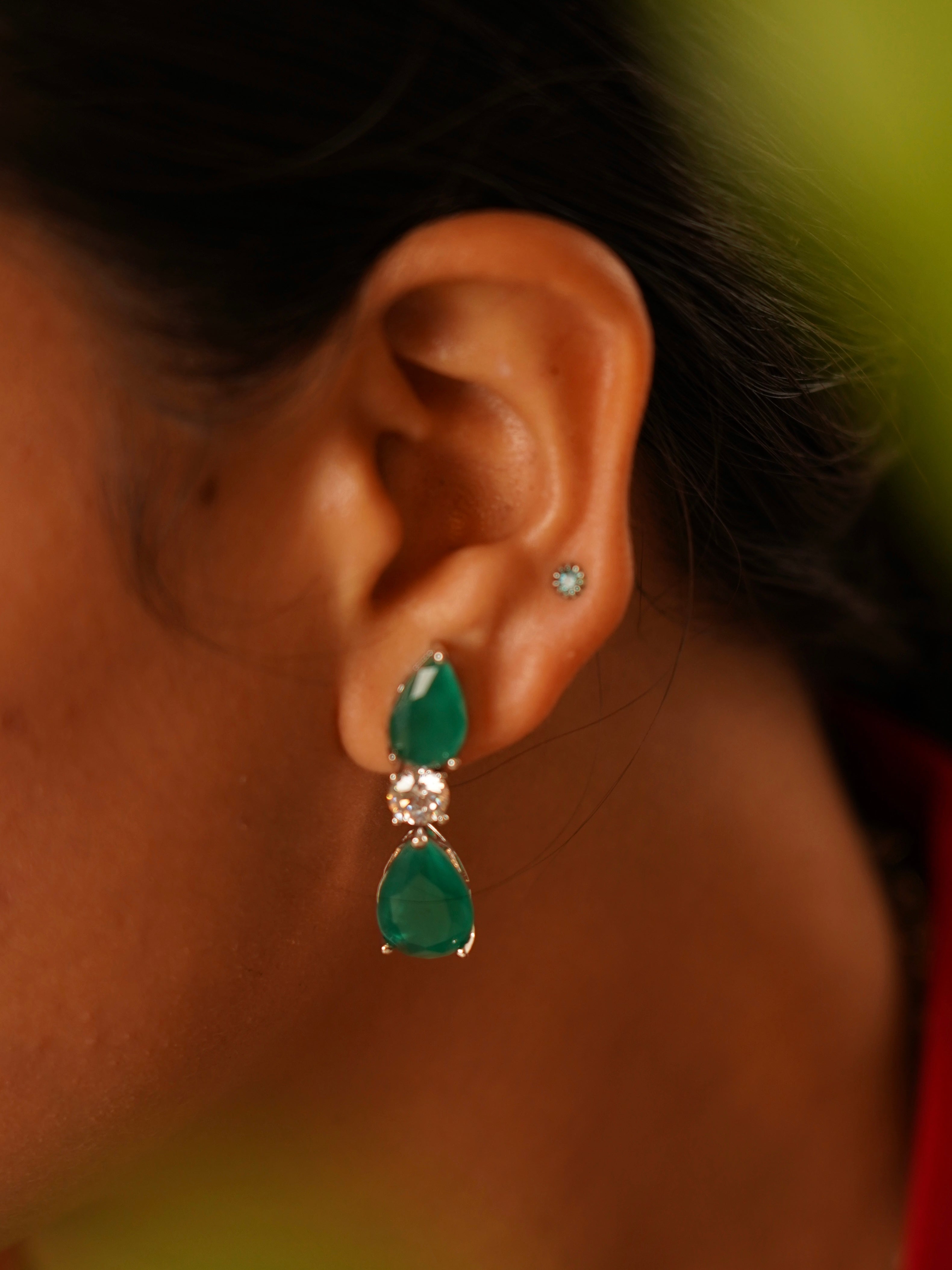 Close-up of emerald diamond necklace showing detailed stonework