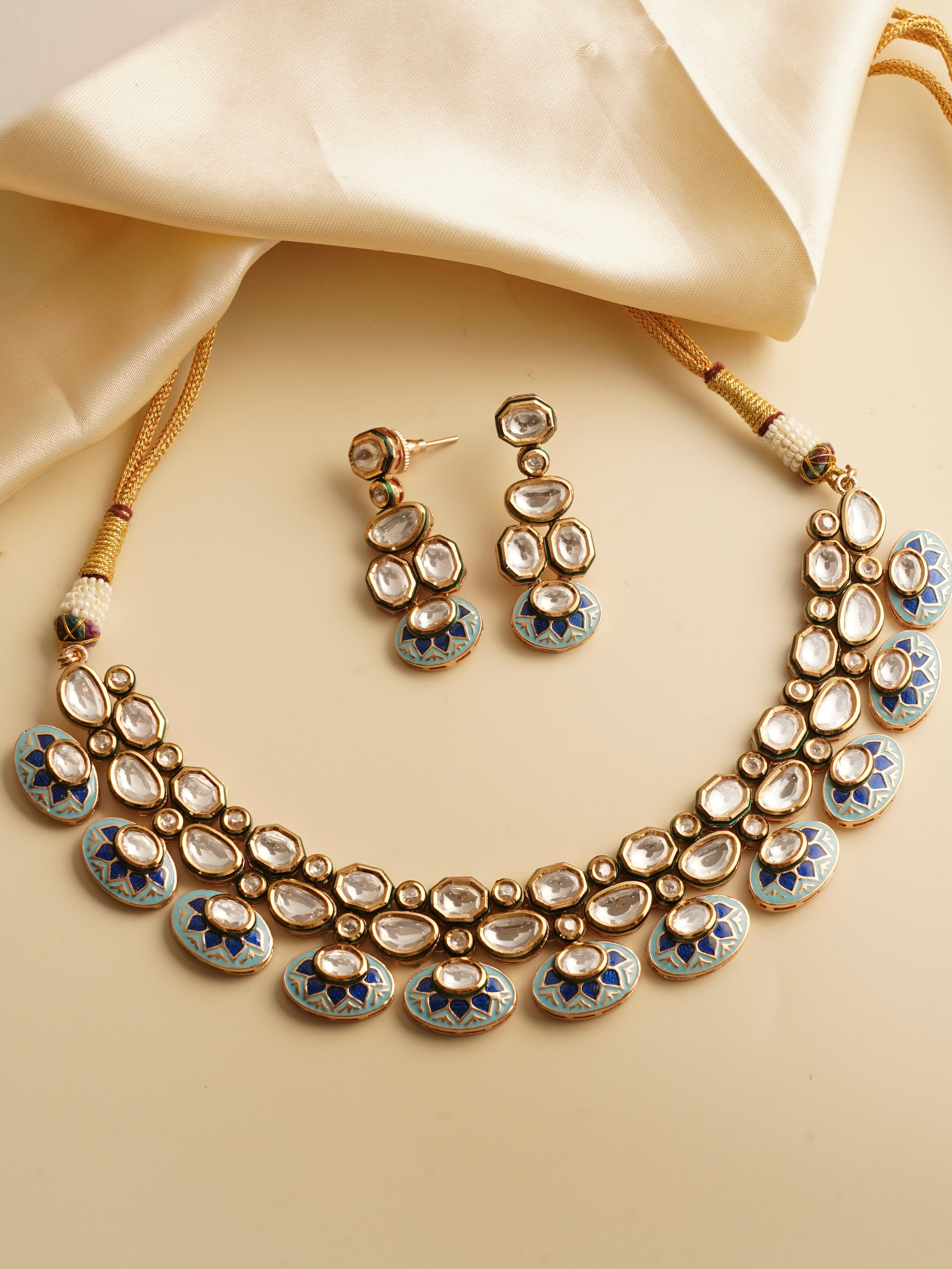 Kundan necklace with meenakari work and gold plating, paired with matching earrings