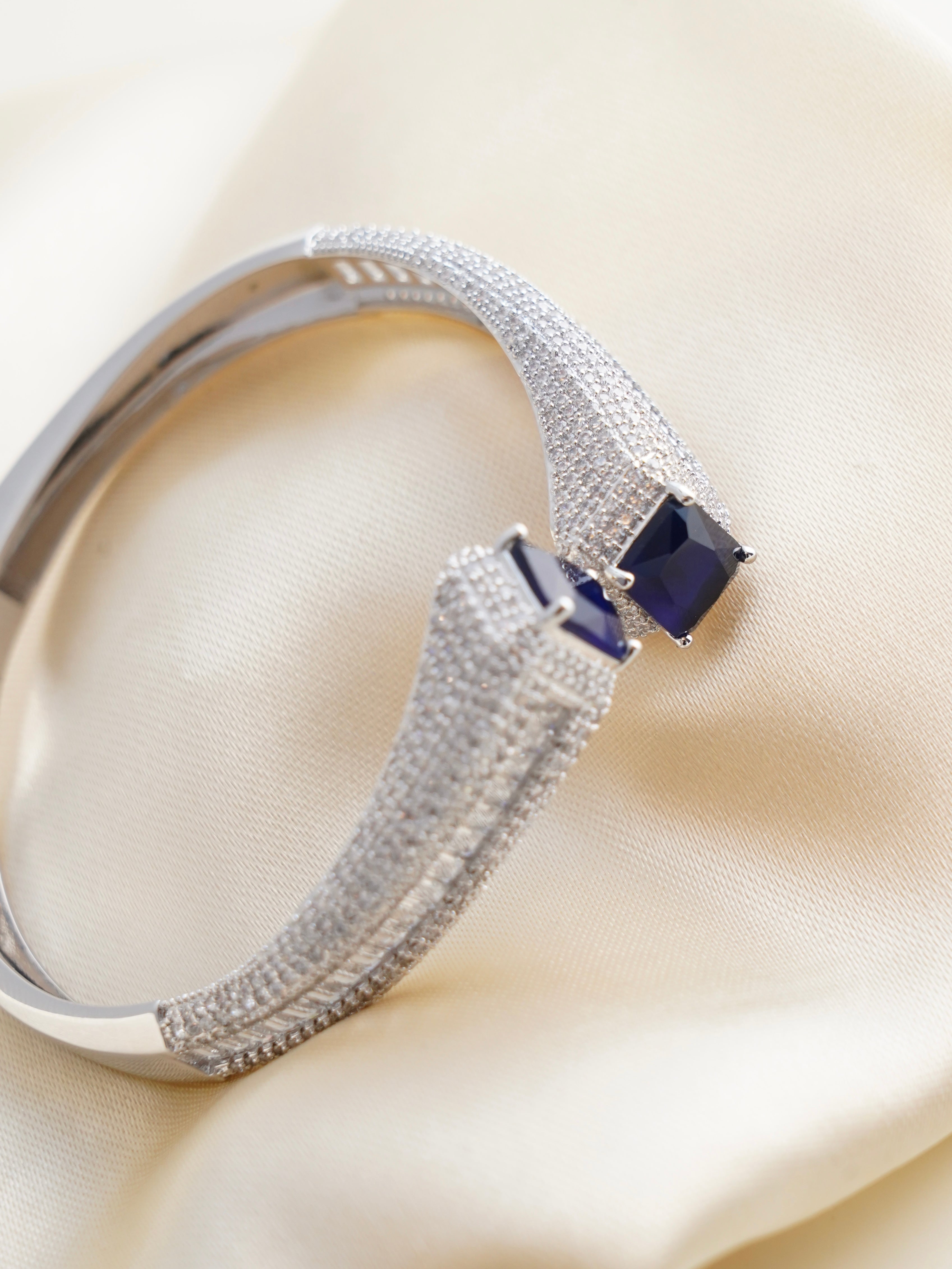 Top view of multicolour Celestia bracelet with baguette-cut stones and secure clasp detail