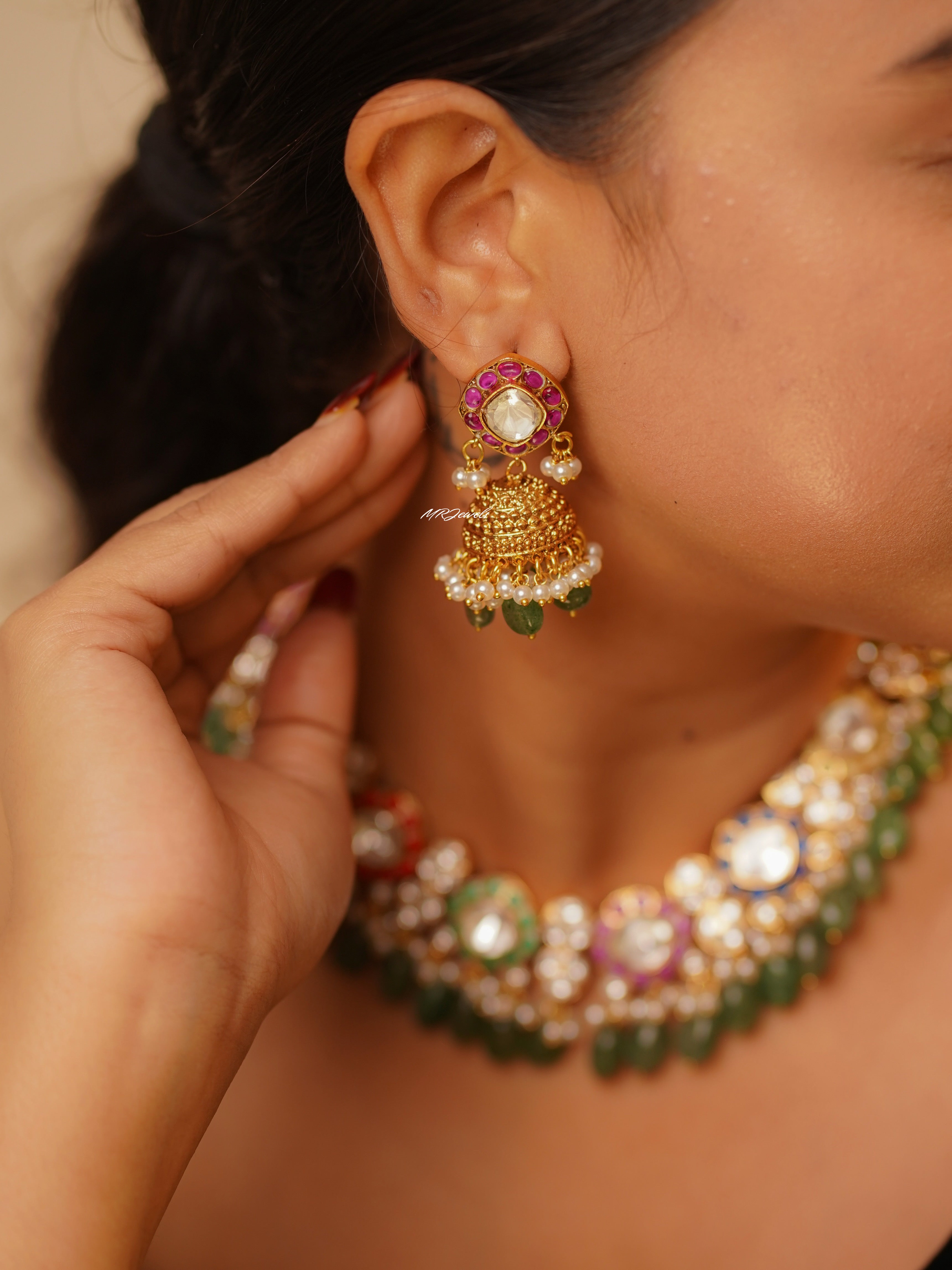Side view of urvi navrattan necklace set showing intricate polki work and matching earrings