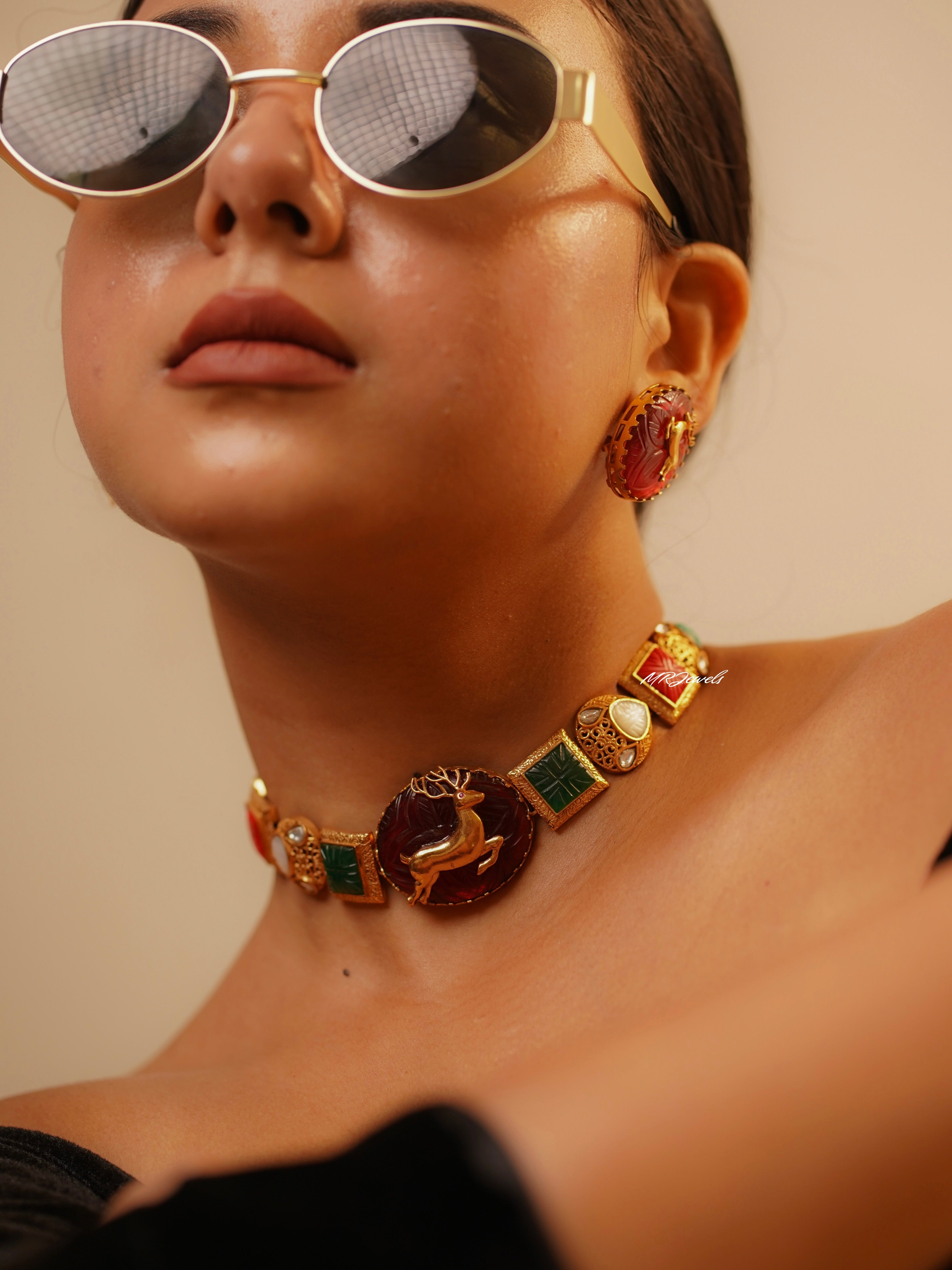 Angled view of vibrant navrattan choker necklace with gold-plated finish