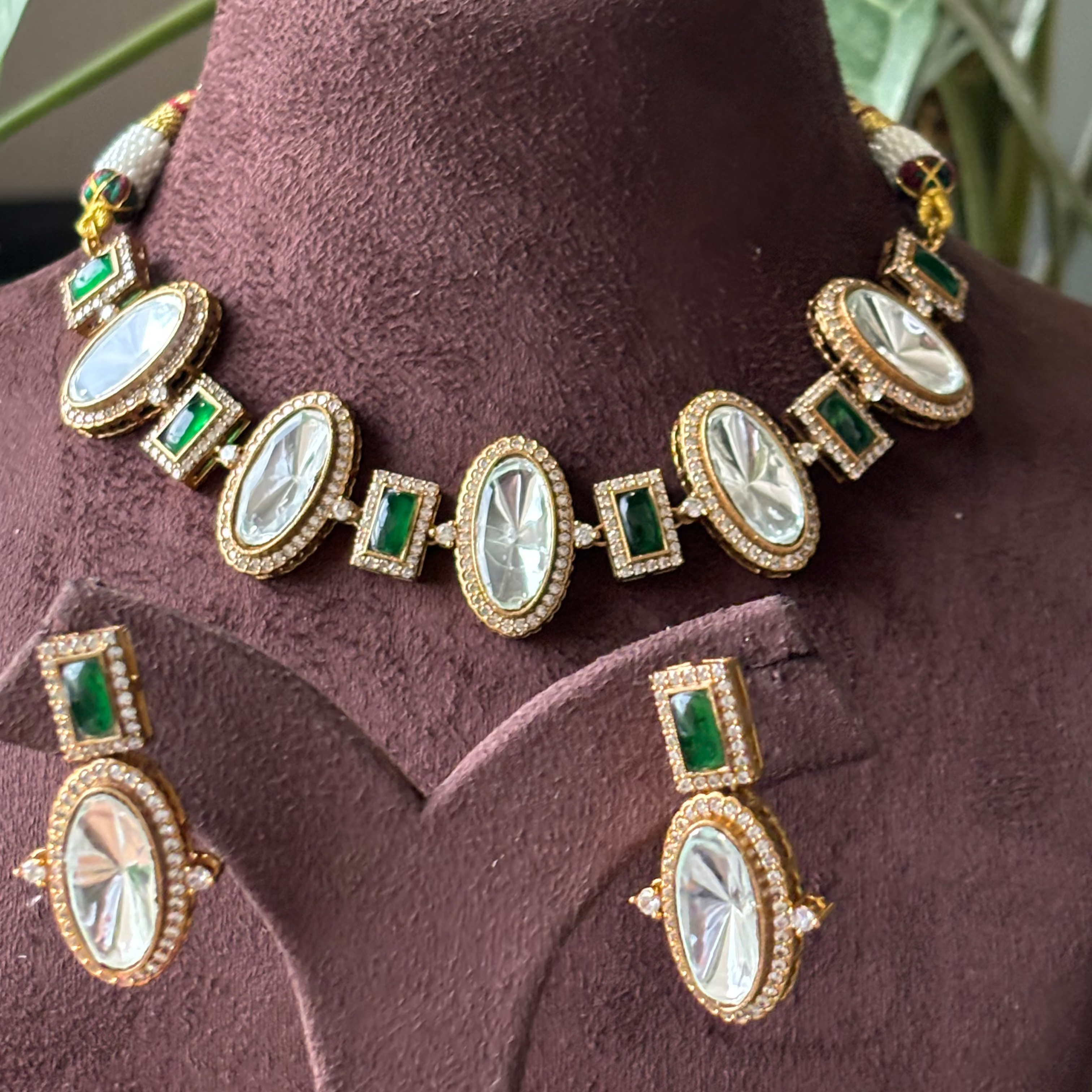 Close-up of kundan necklace showcasing uncut polki and white-red CZ stones