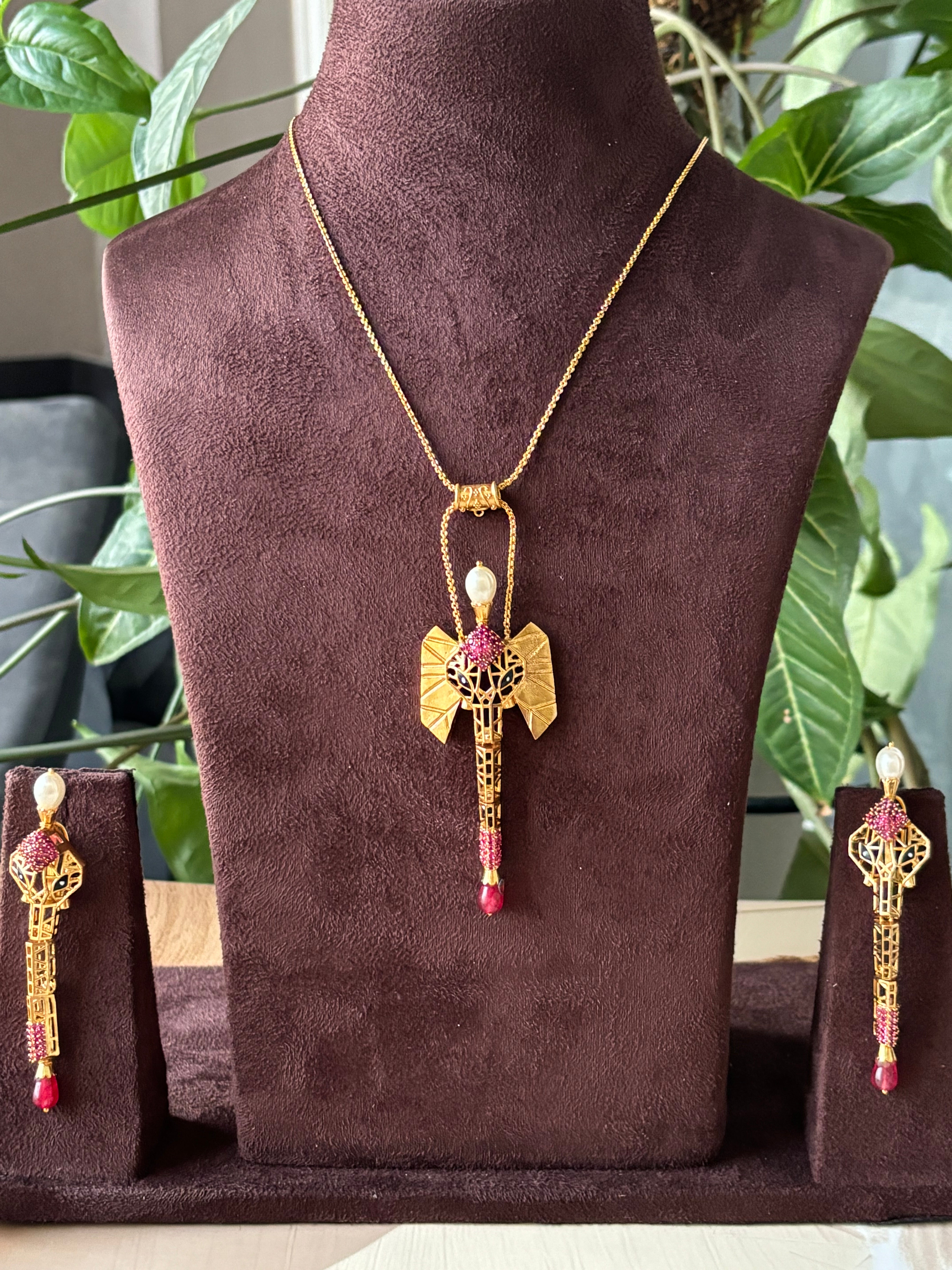 Indo-western pendant set with gold plating and matching long earrings