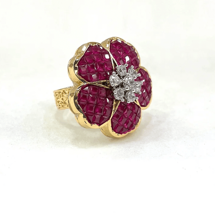 top view of ruby floral ring with gemstone petals and brilliant diamond centre